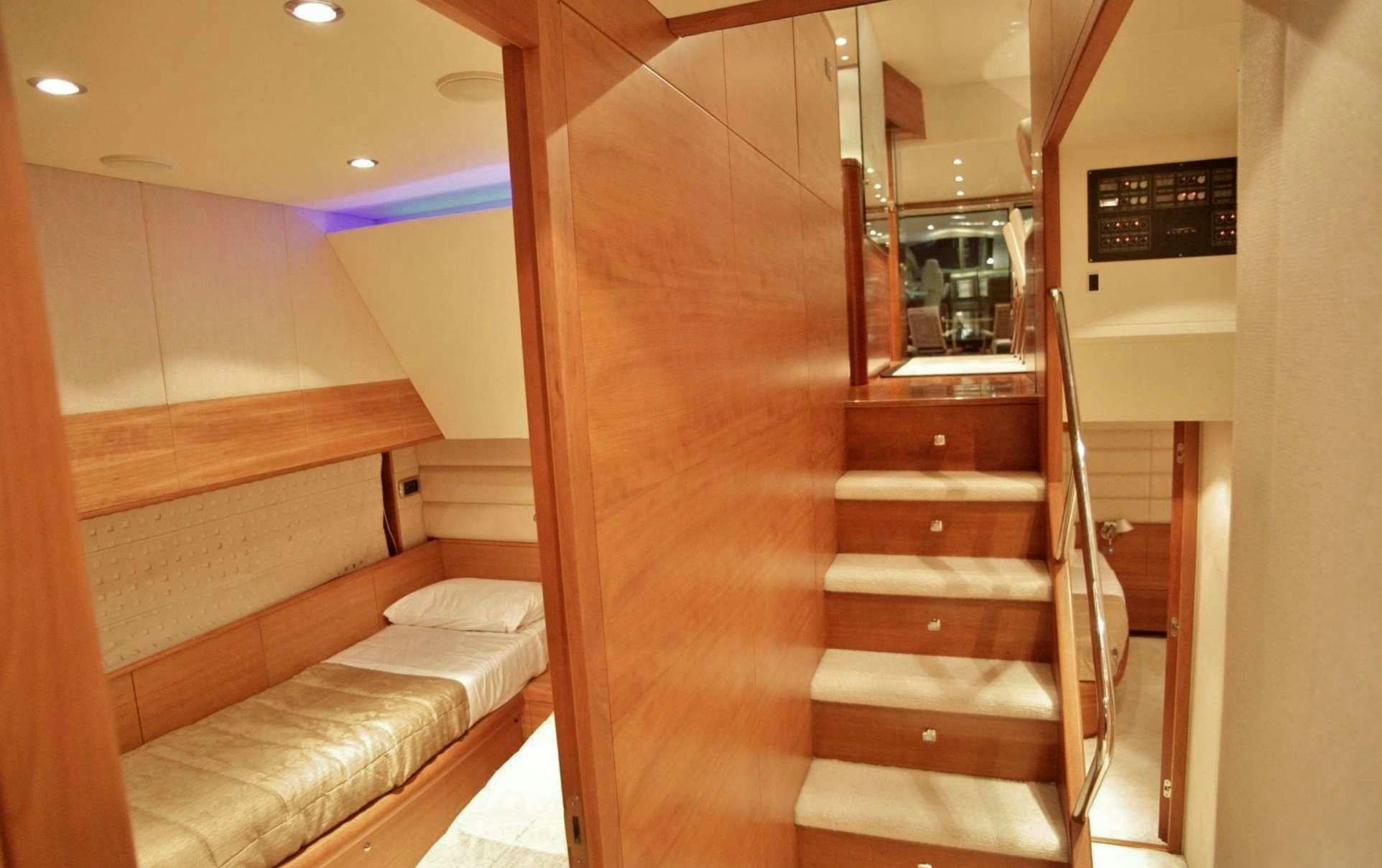 a wooden staircase in a room aboard REVIVAL Yacht for Charter