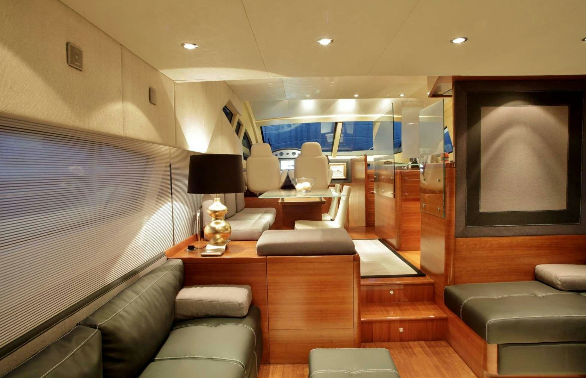 a living room with a large television aboard REVIVAL Yacht for Charter