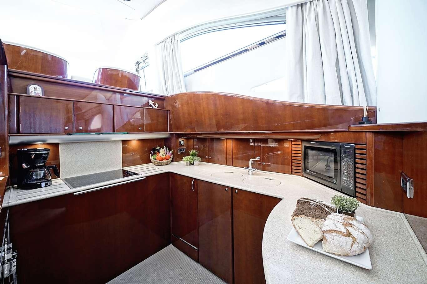 a kitchen with a countertop aboard DISTAR PRINCESS Yacht for Charter