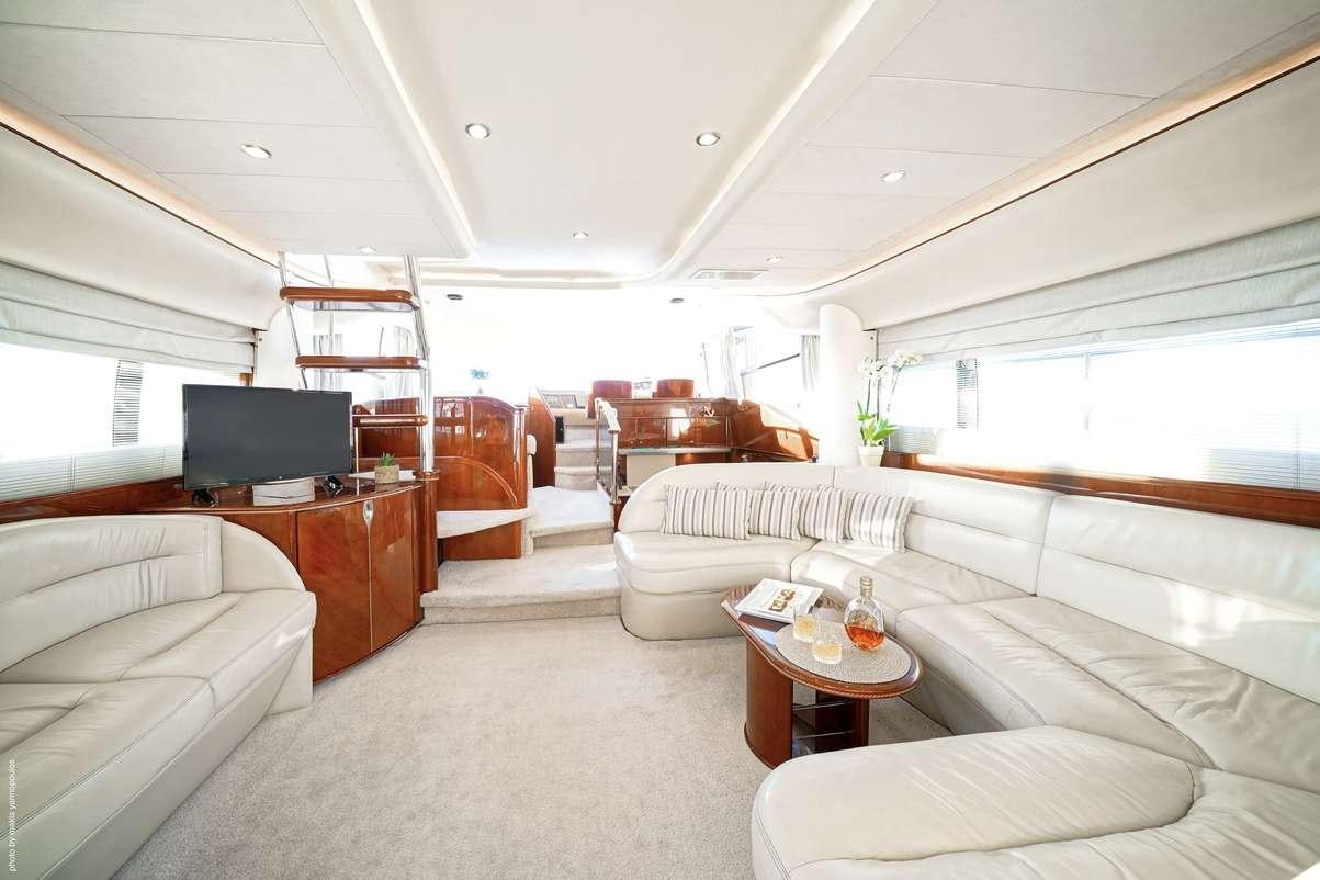 a living room with a large window aboard DISTAR PRINCESS Yacht for Charter
