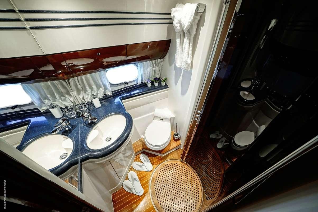 a bathroom with a sink and a toilet aboard DISTAR PRINCESS Yacht for Charter