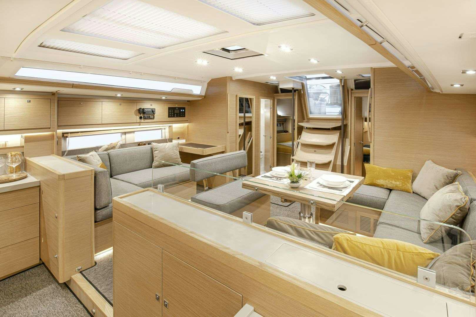 a room with a couch and a table aboard DIMPA Yacht for Charter