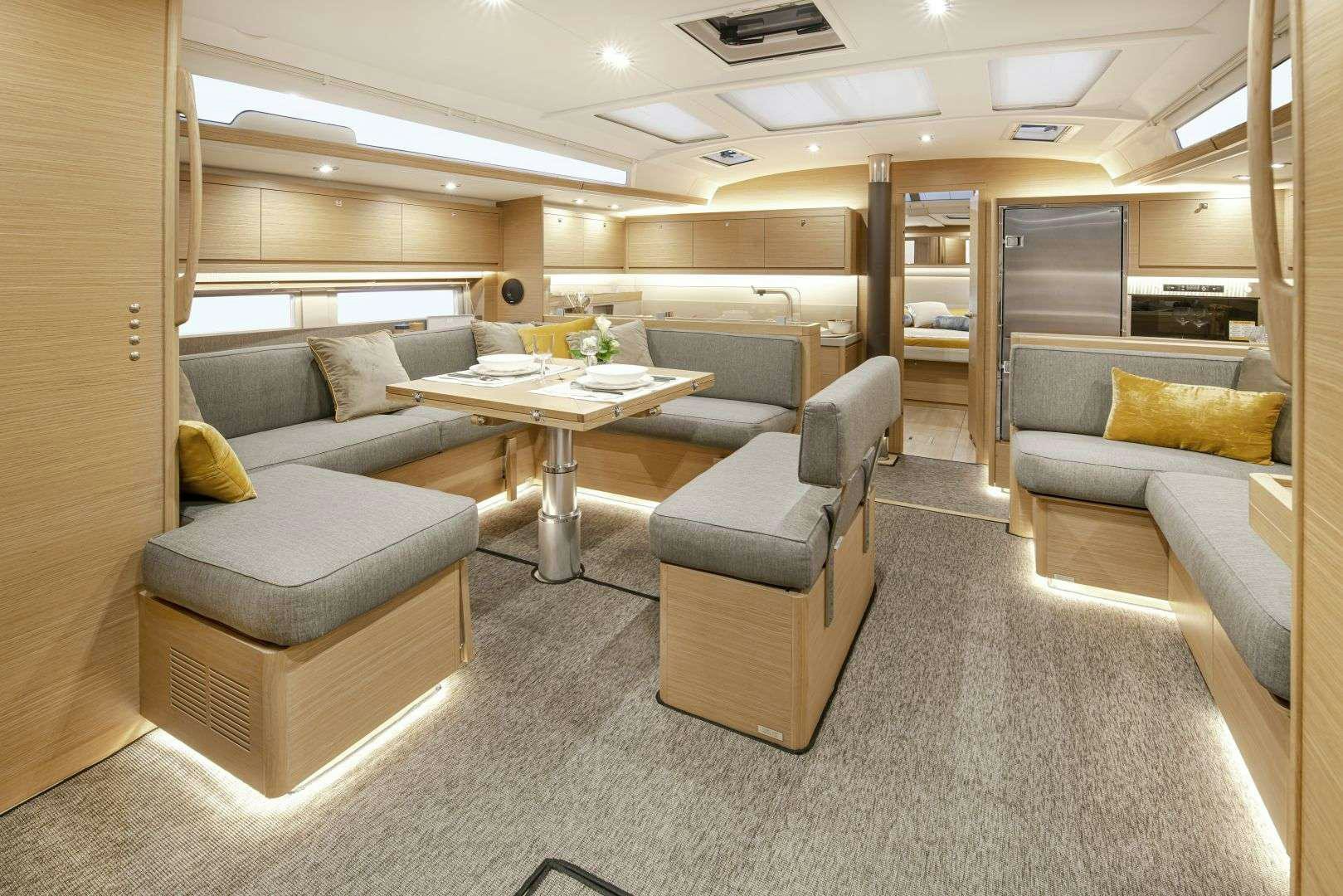 a room with couches and a table aboard DIMPA Yacht for Charter