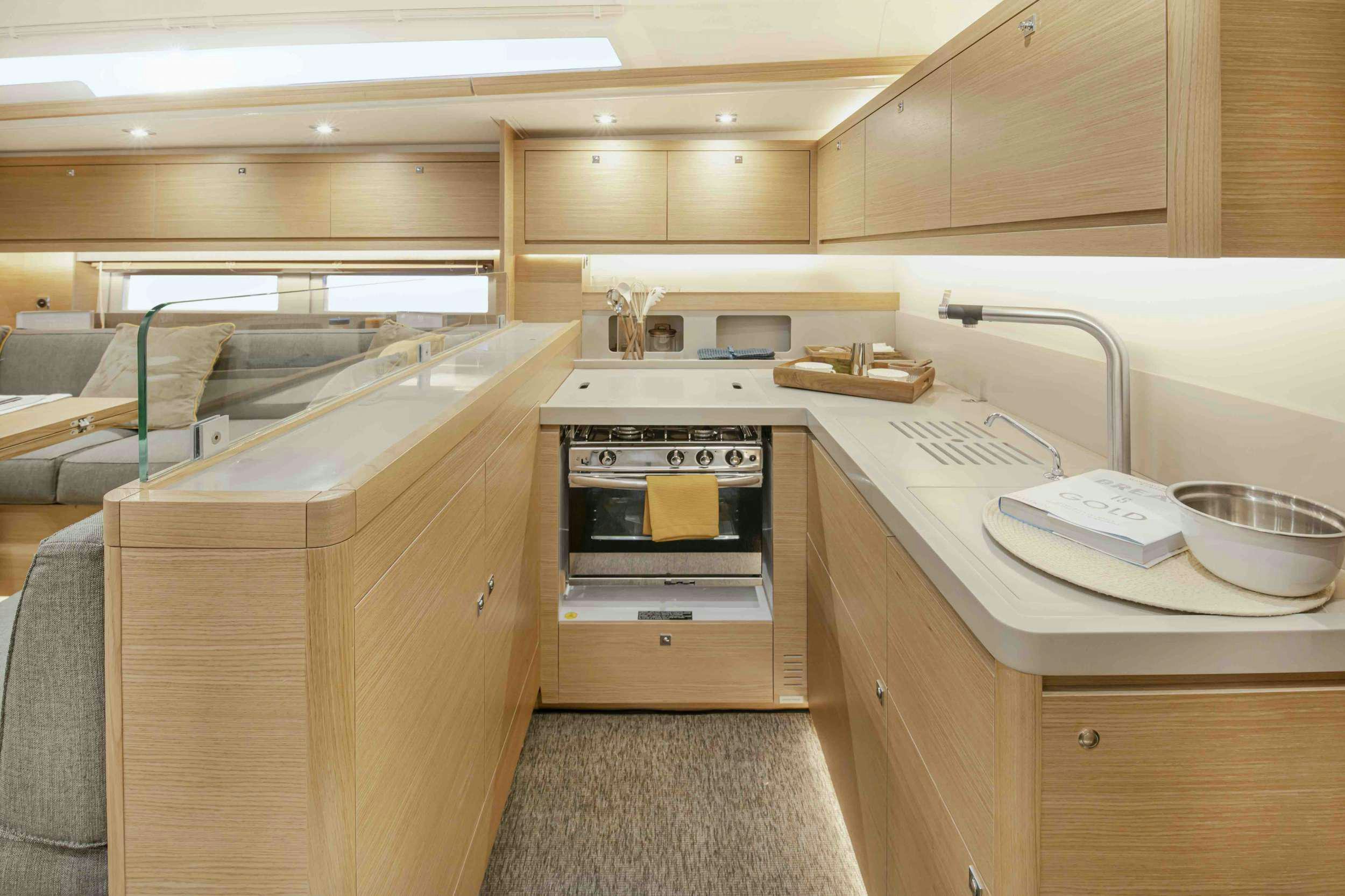 a kitchen with a stove and sink aboard DIMPA Yacht for Charter