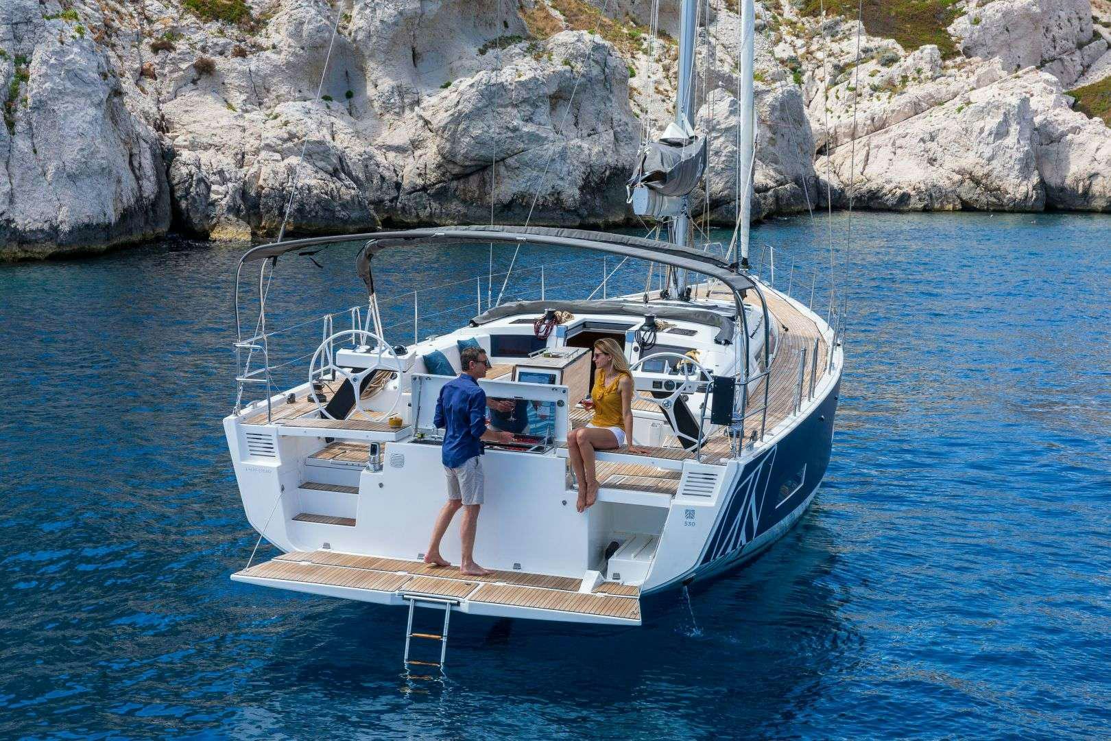 a couple people on a boat aboard DIMPA Yacht for Charter