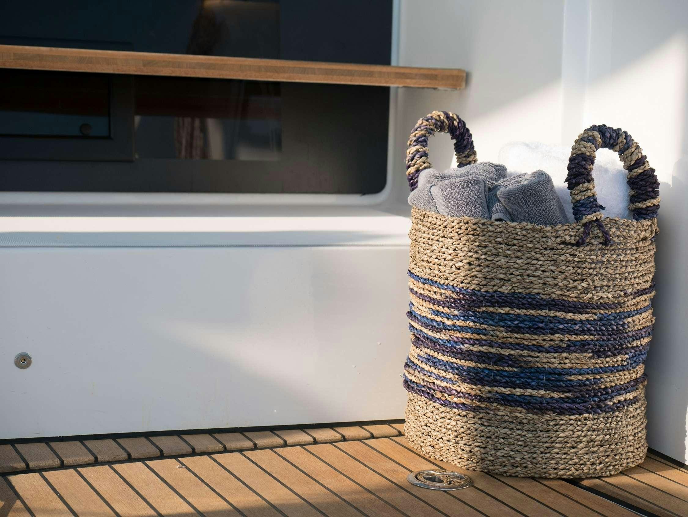 a basket with a towel on it aboard ANDIAMO Yacht for Charter