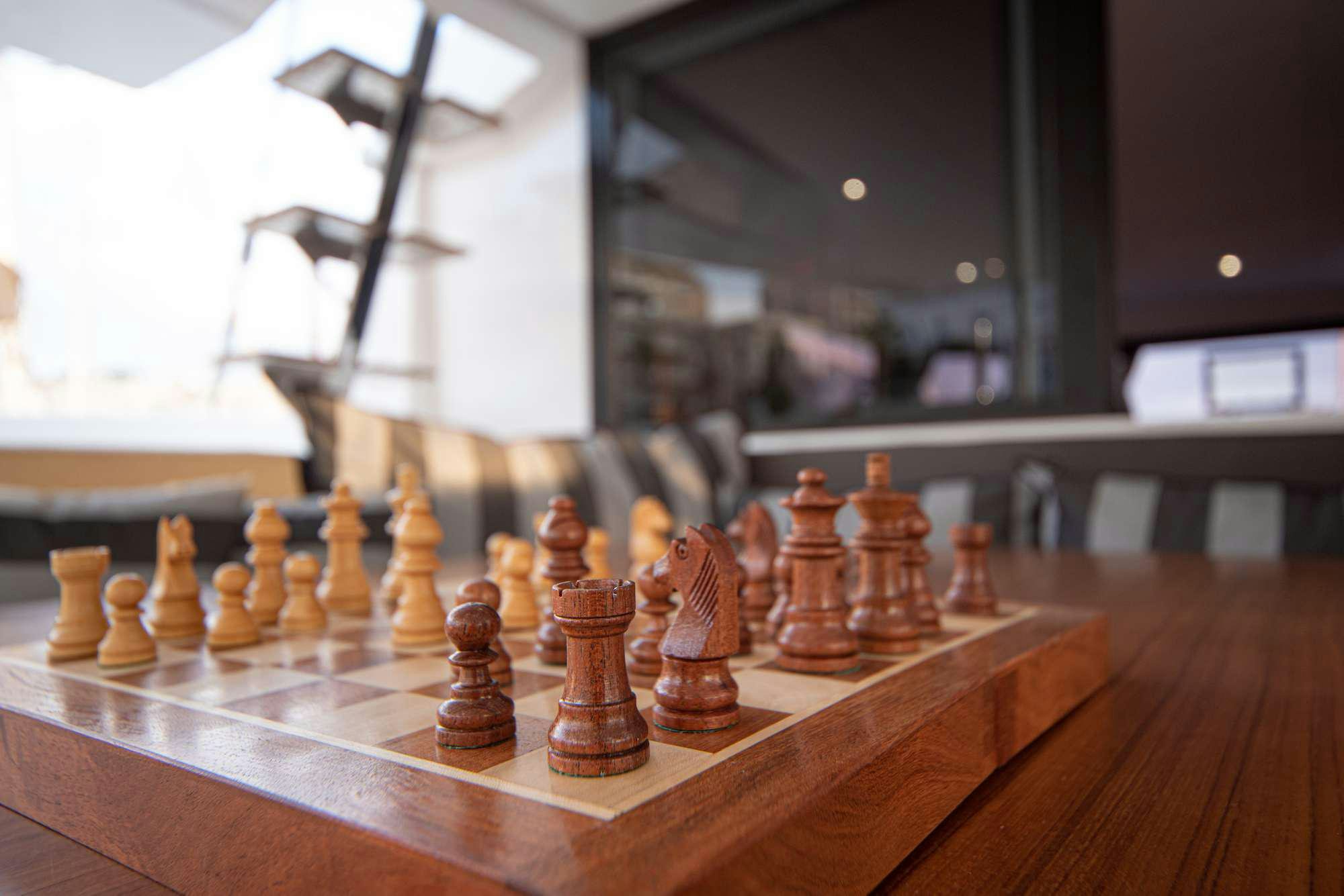 a chess board with a chess board aboard MY BLUE HEAVEN Yacht for Charter