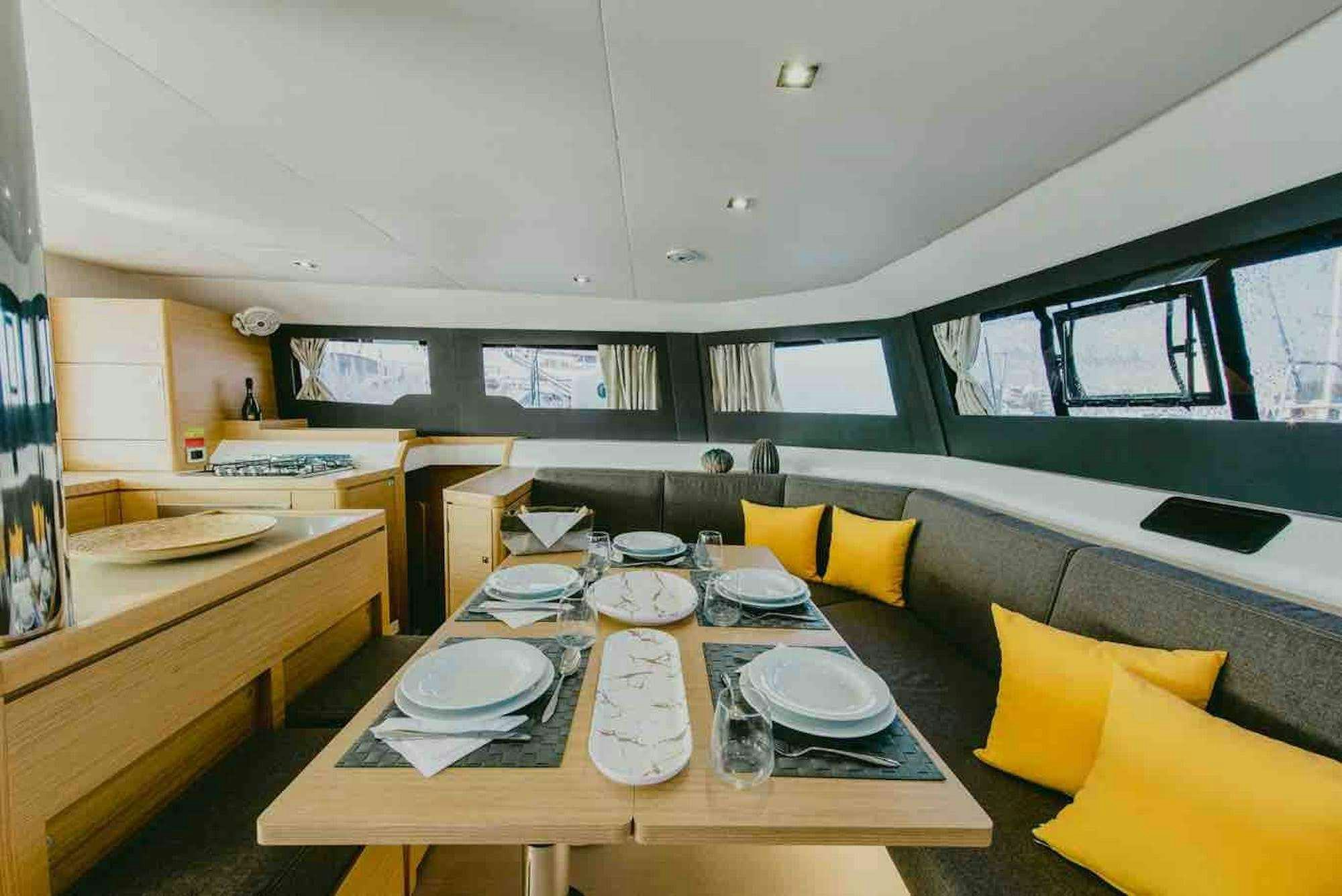 a table with plates and plates on it aboard MY BLUE HEAVEN Yacht for Charter
