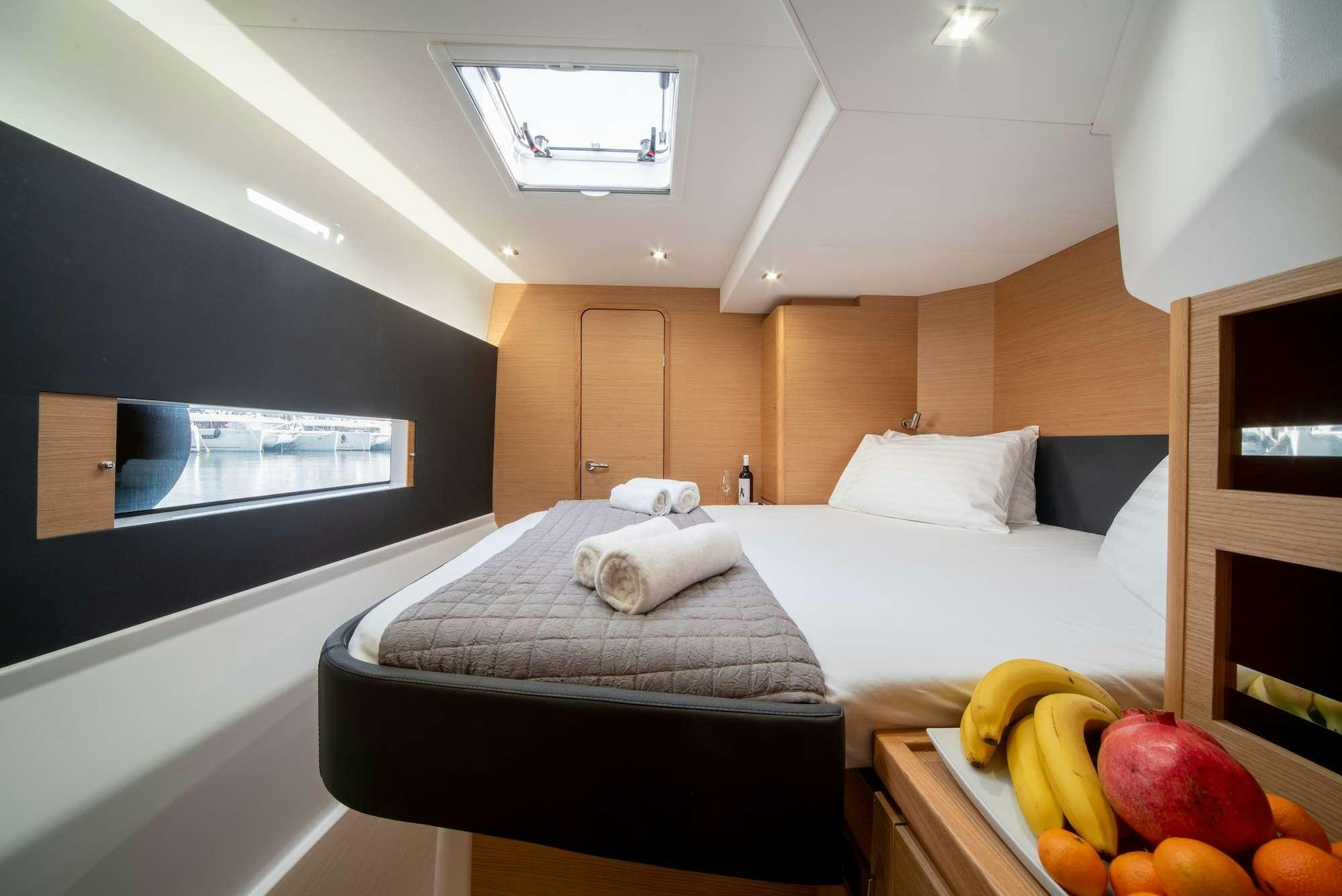 a bedroom with a bed and a tv aboard MY BLUE HEAVEN Yacht for Charter