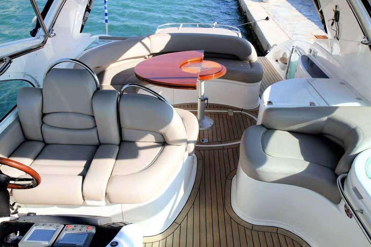 a boat with seats aboard JODI Yacht for Charter