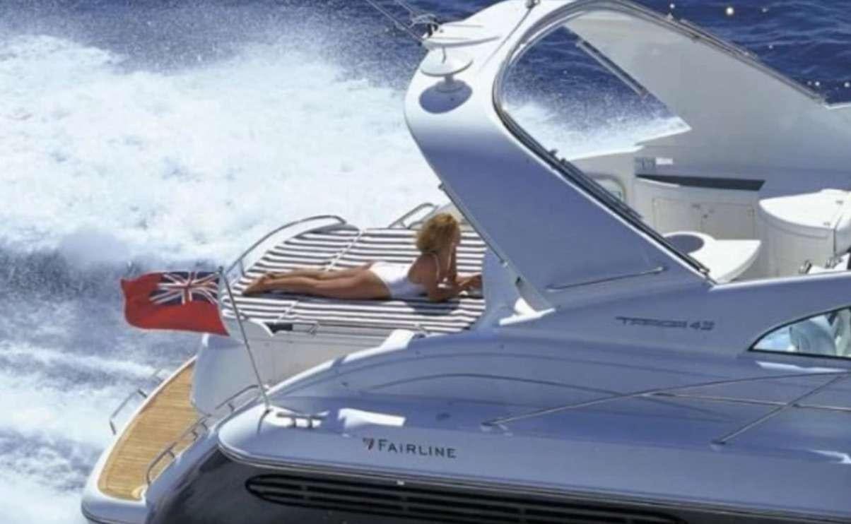 a person driving a boat aboard JODI Yacht for Charter