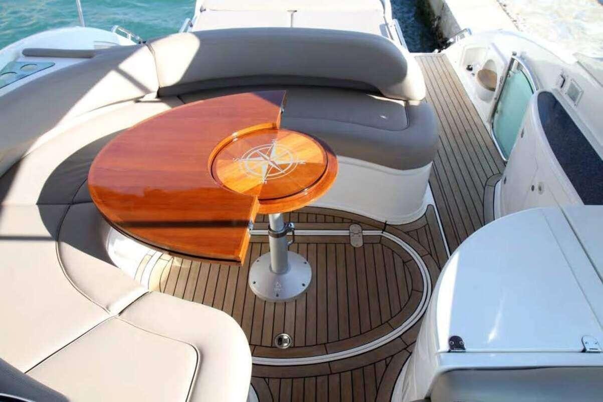 a brown and black drum set aboard JODI Yacht for Charter