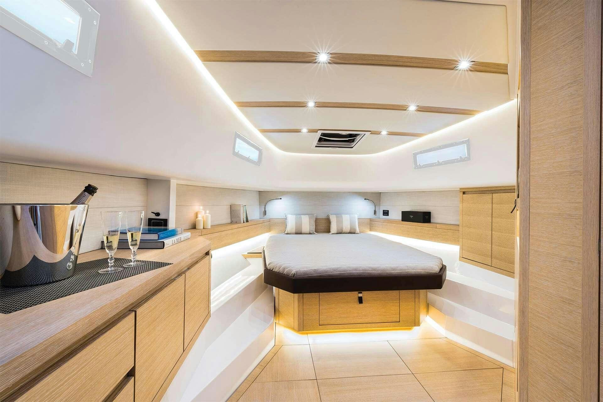 a kitchen with a sink and a bed aboard BABY D Yacht for Charter