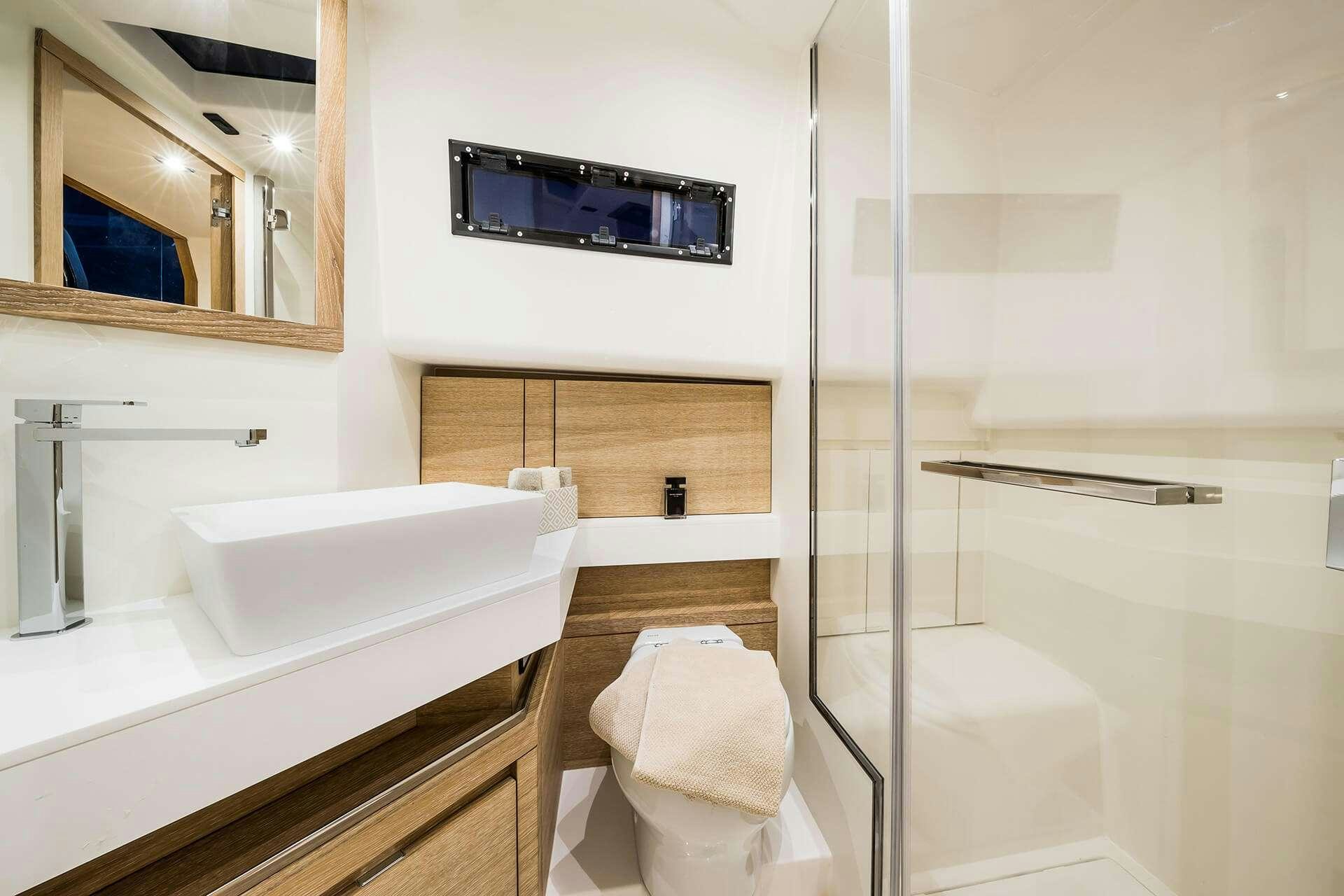 a bathroom with a glass shower aboard BABY D Yacht for Charter