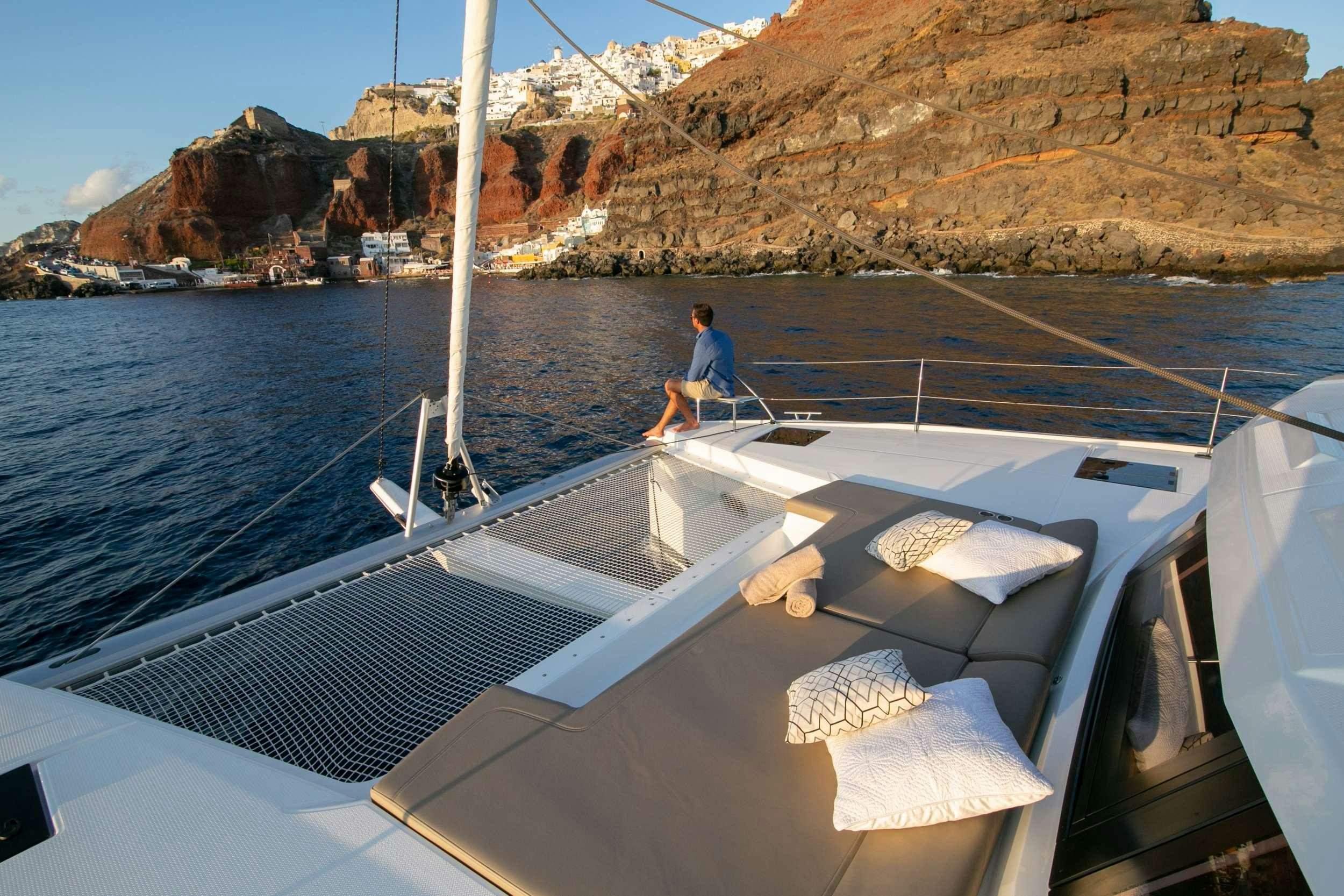 a person sitting on a boat aboard PAROS Yacht for Charter