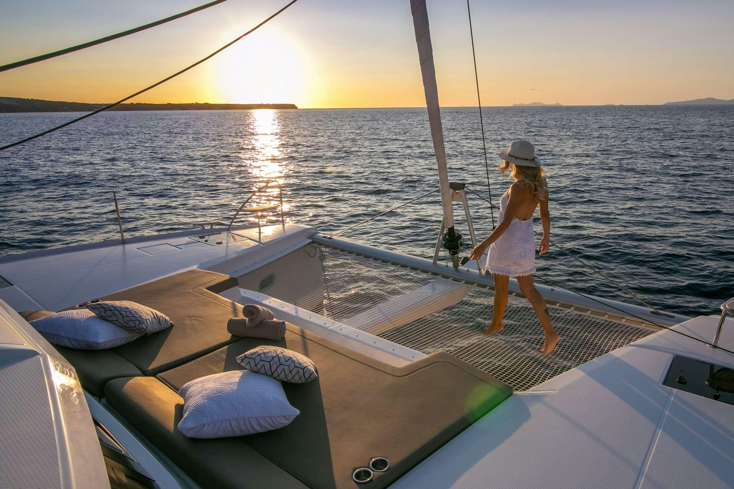 a person standing on a boat aboard PAROS Yacht for Charter