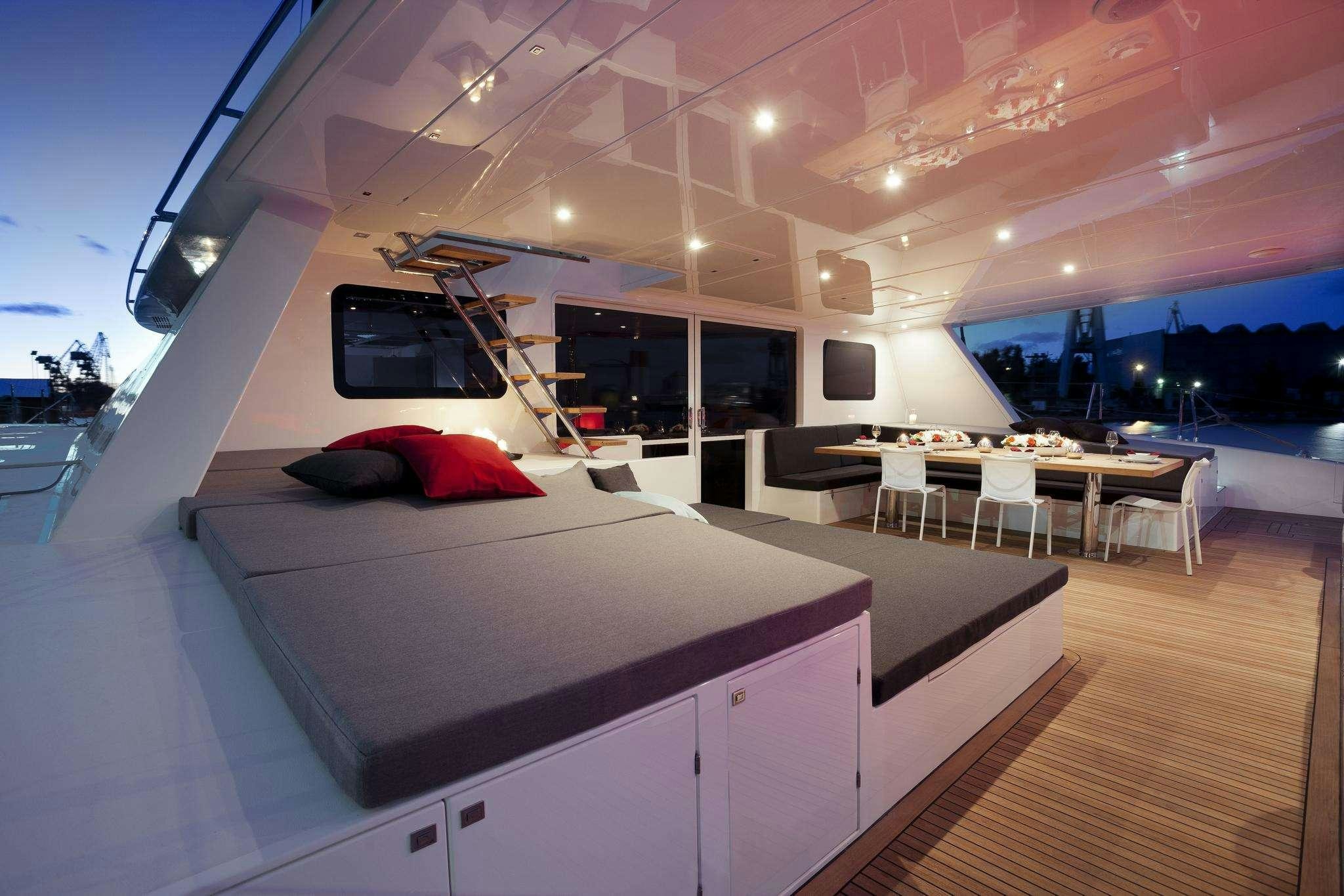 a room with a bed and a tv aboard LEVANTE Yacht for Charter