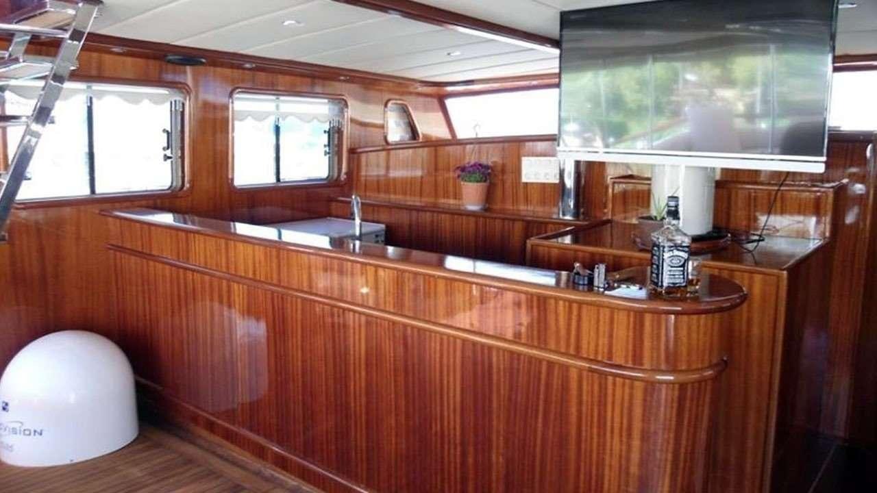 a kitchen with wooden cabinets aboard M/S E.ARDA DENIZ Yacht for Charter