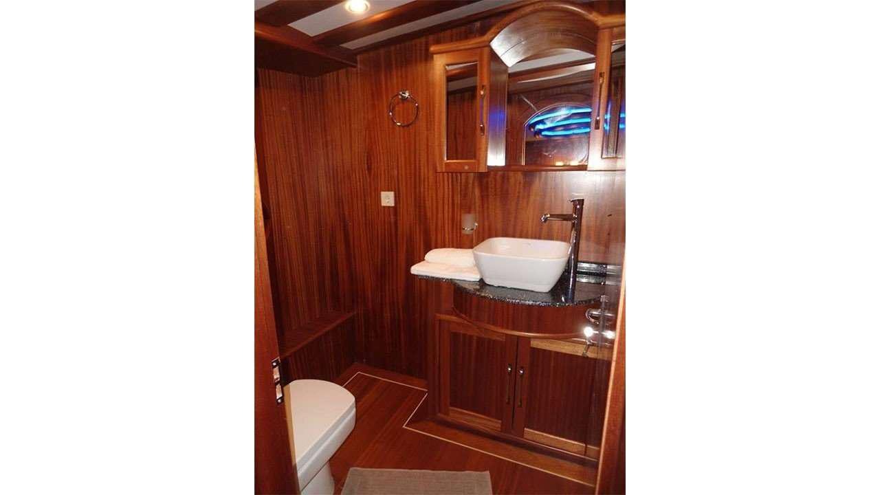 a bathroom with a sink and a mirror aboard M/S E.ARDA DENIZ Yacht for Charter