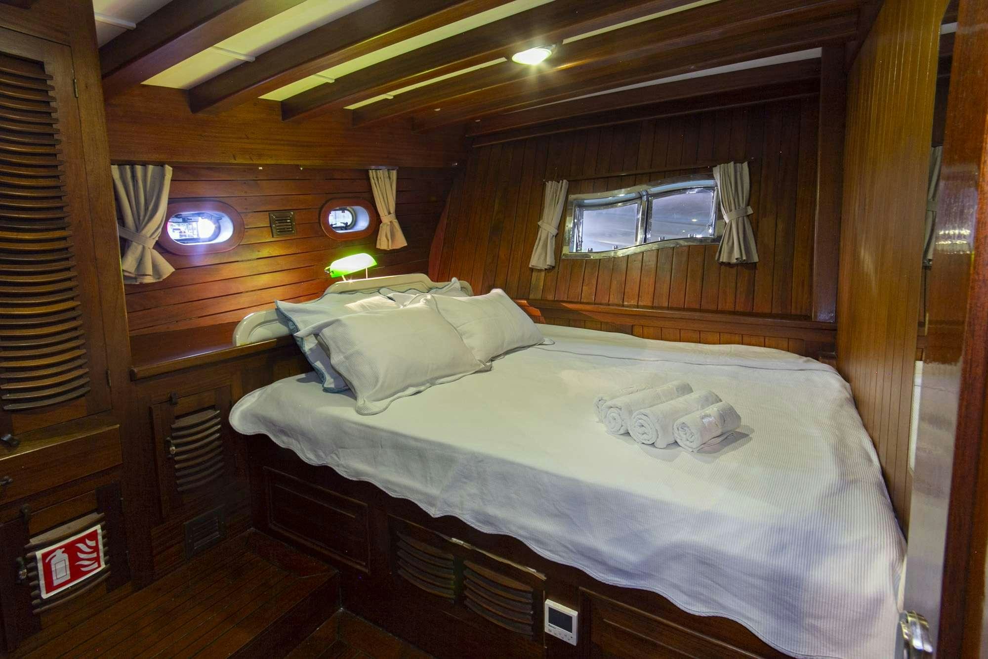 a bed in a cabin aboard SERENAD Yacht for Charter