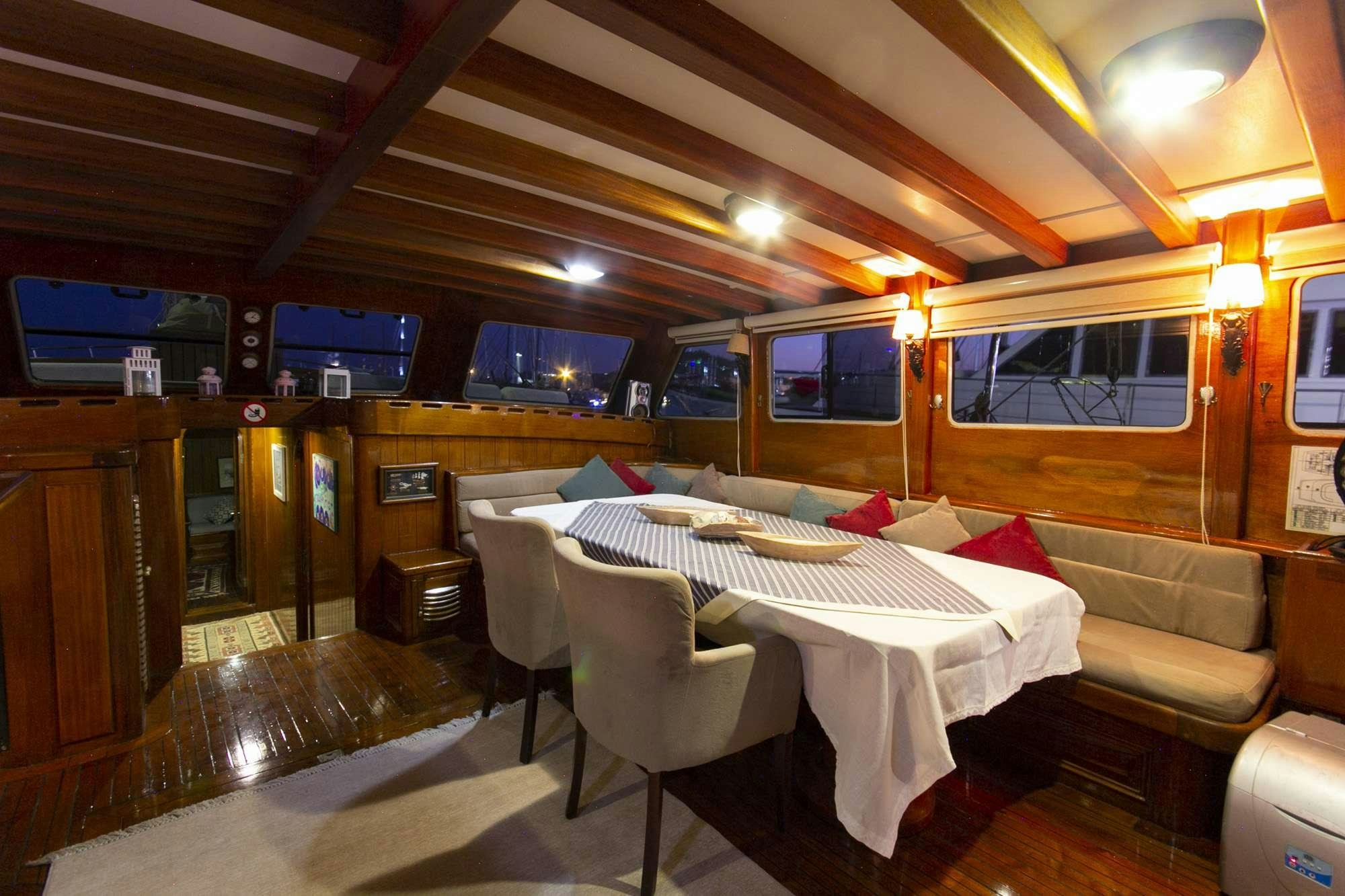 a room with a table and chairs aboard SERENAD Yacht for Charter