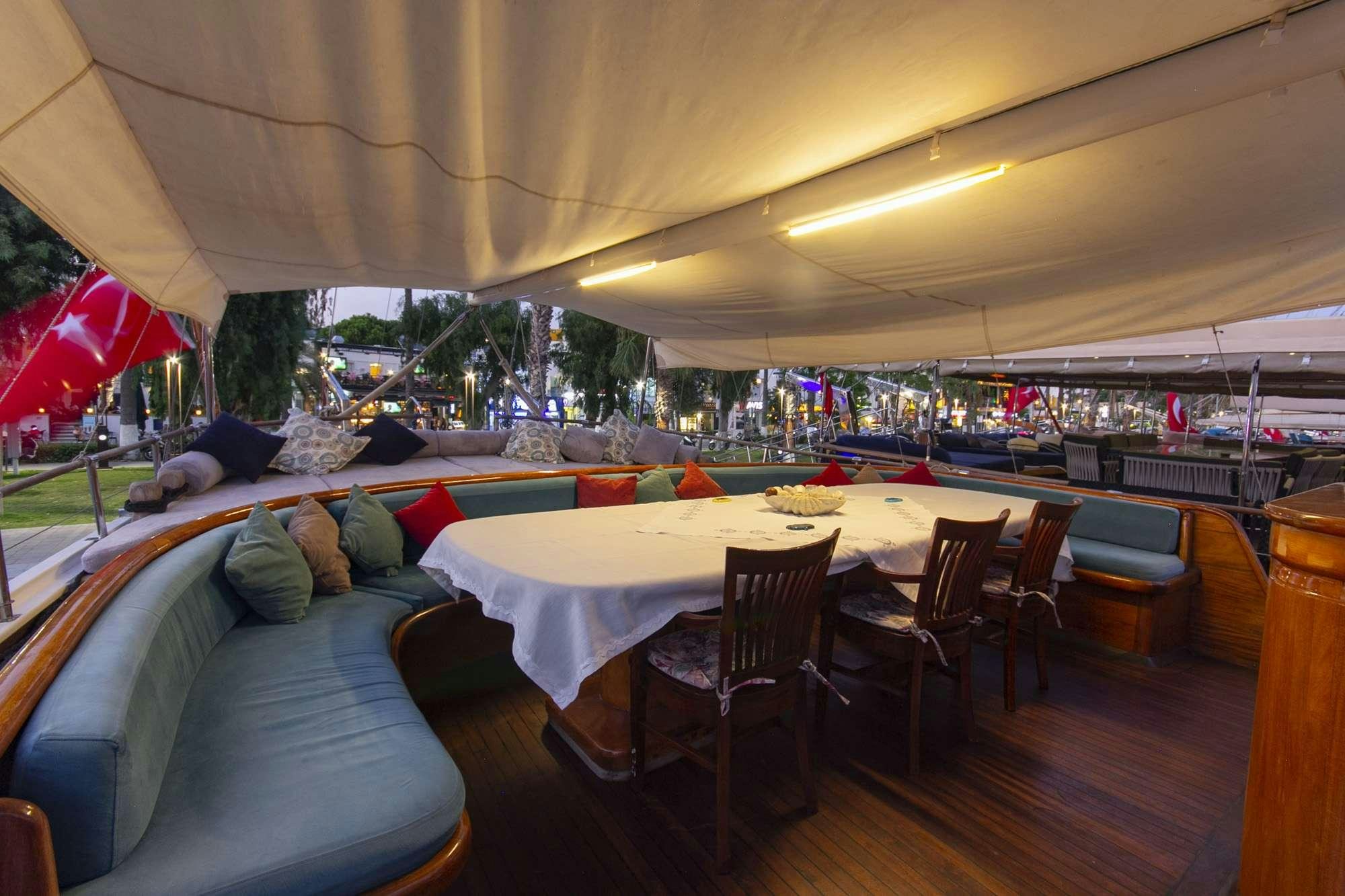 a tent with tables and chairs aboard SERENAD Yacht for Charter