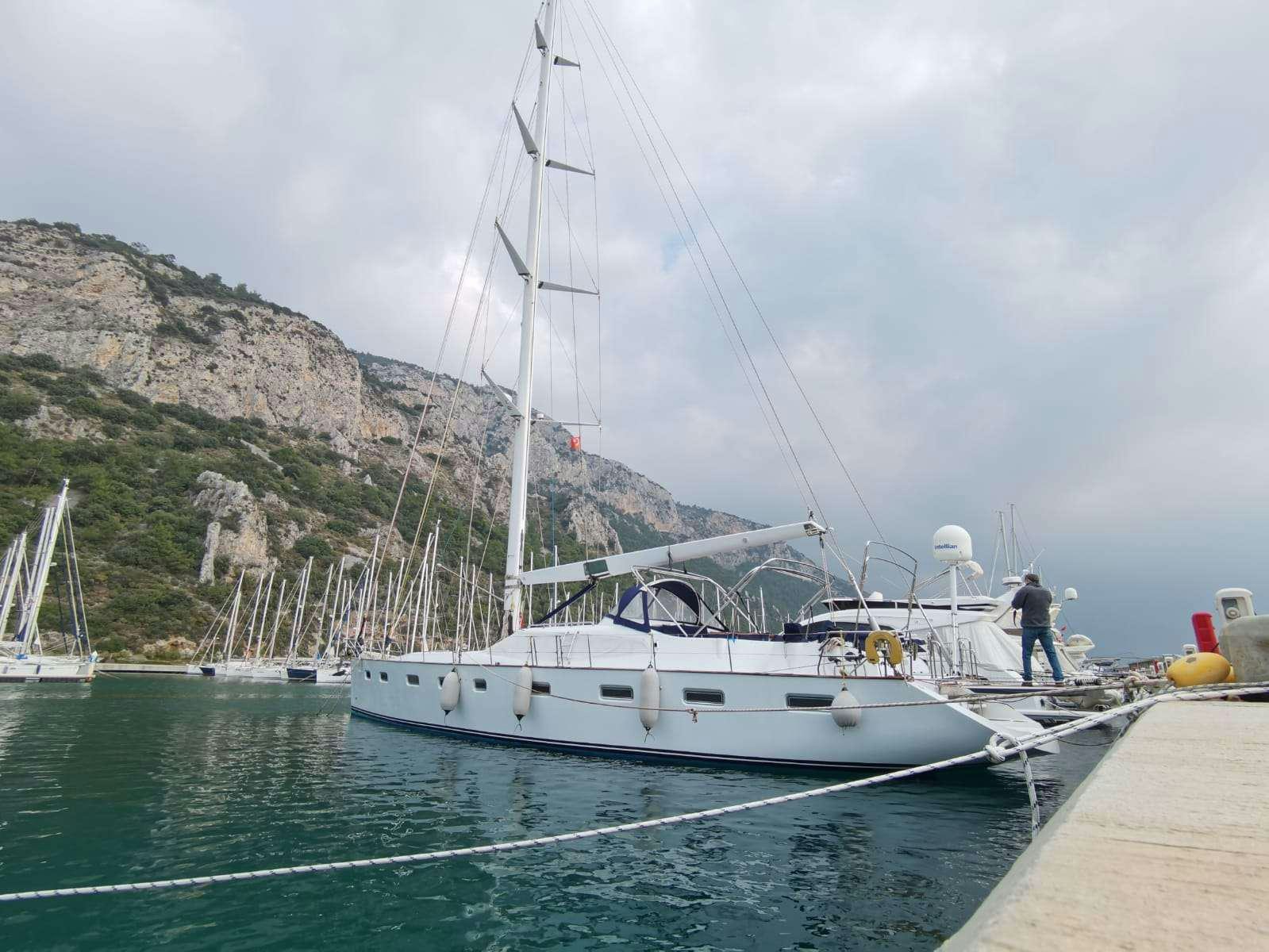 a boat docked at a dock aboard BELLA Yacht for Charter