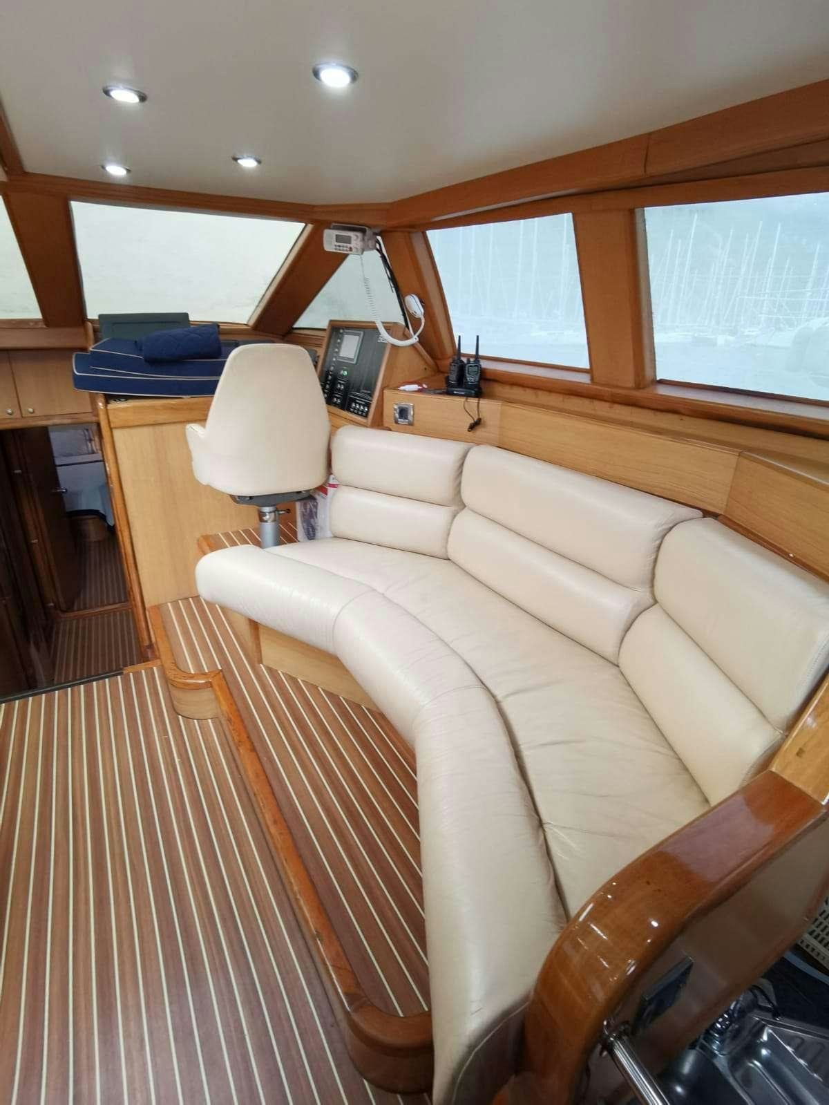 a room with a couch and a table aboard BELLA Yacht for Charter