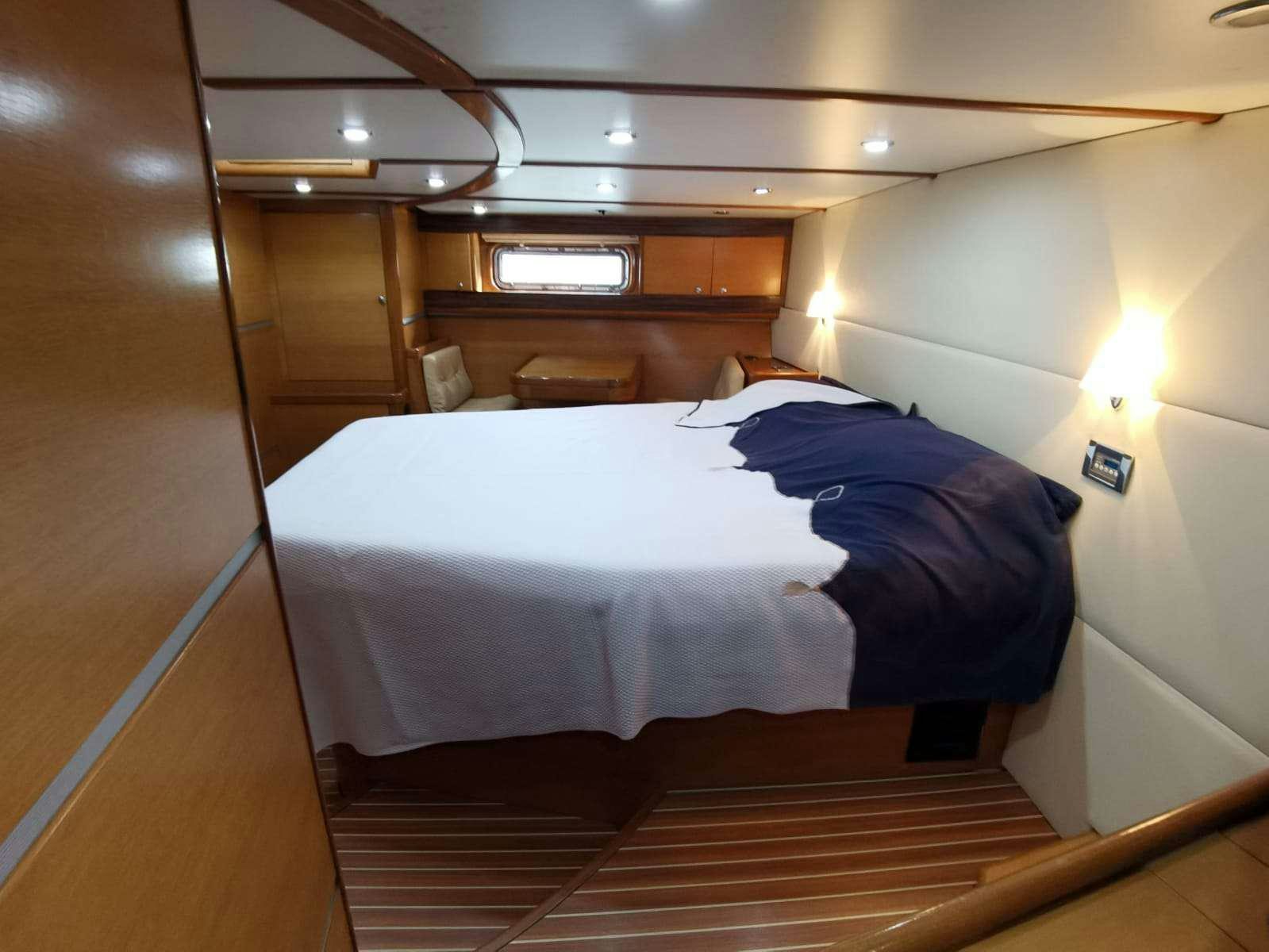 a bed in a room aboard BELLA Yacht for Charter