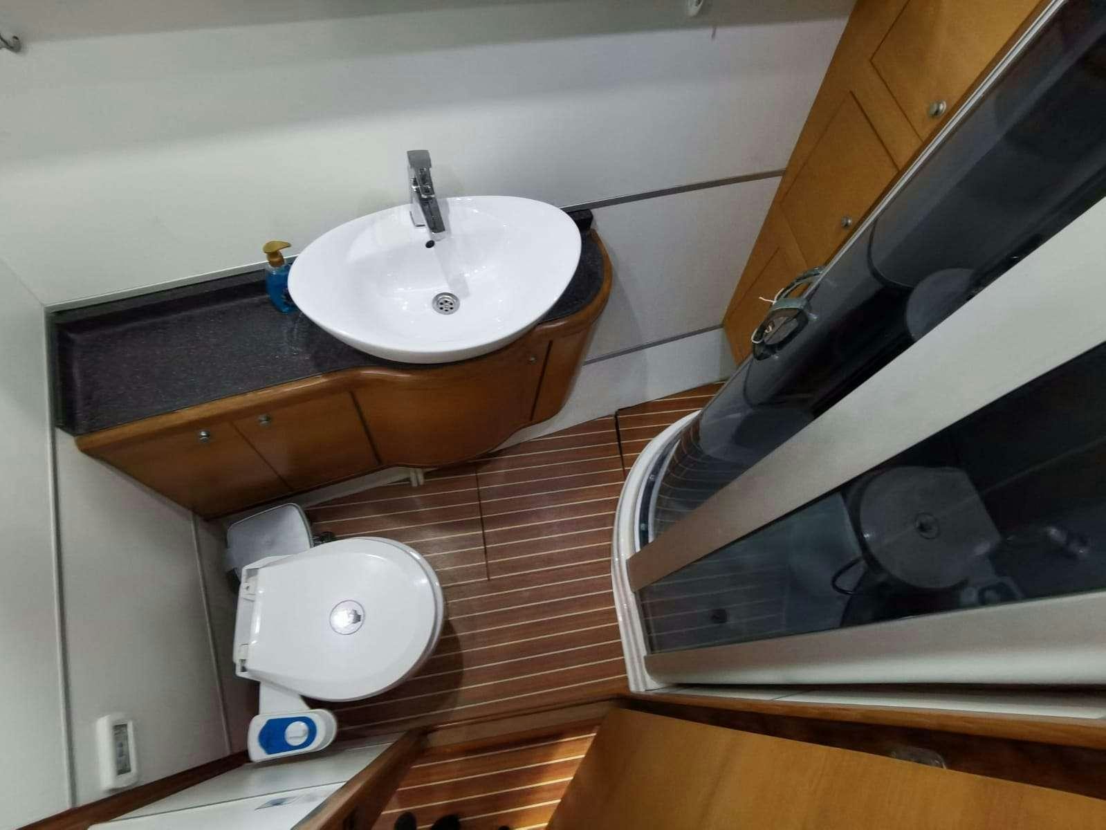 a sink and a toilet in a bathroom aboard BELLA Yacht for Charter