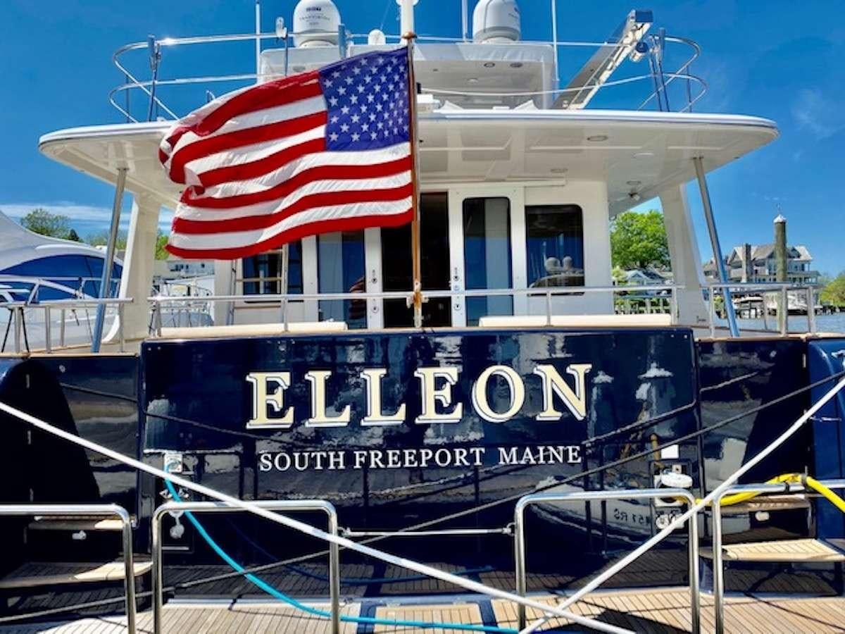 a boat with a flag on it aboard ELLEON Yacht for Charter