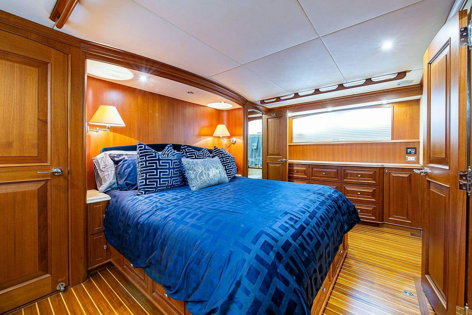 a bedroom with a large bed aboard ELLEON Yacht for Charter