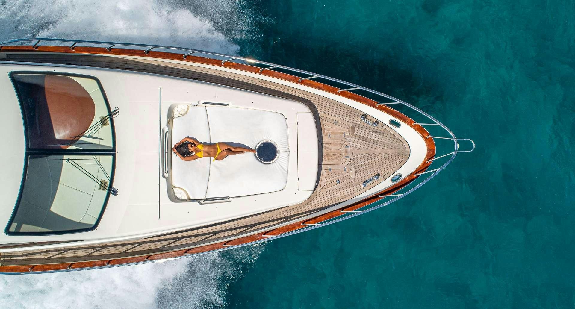 a compass on a piece of wood aboard grace Yacht for Charter
