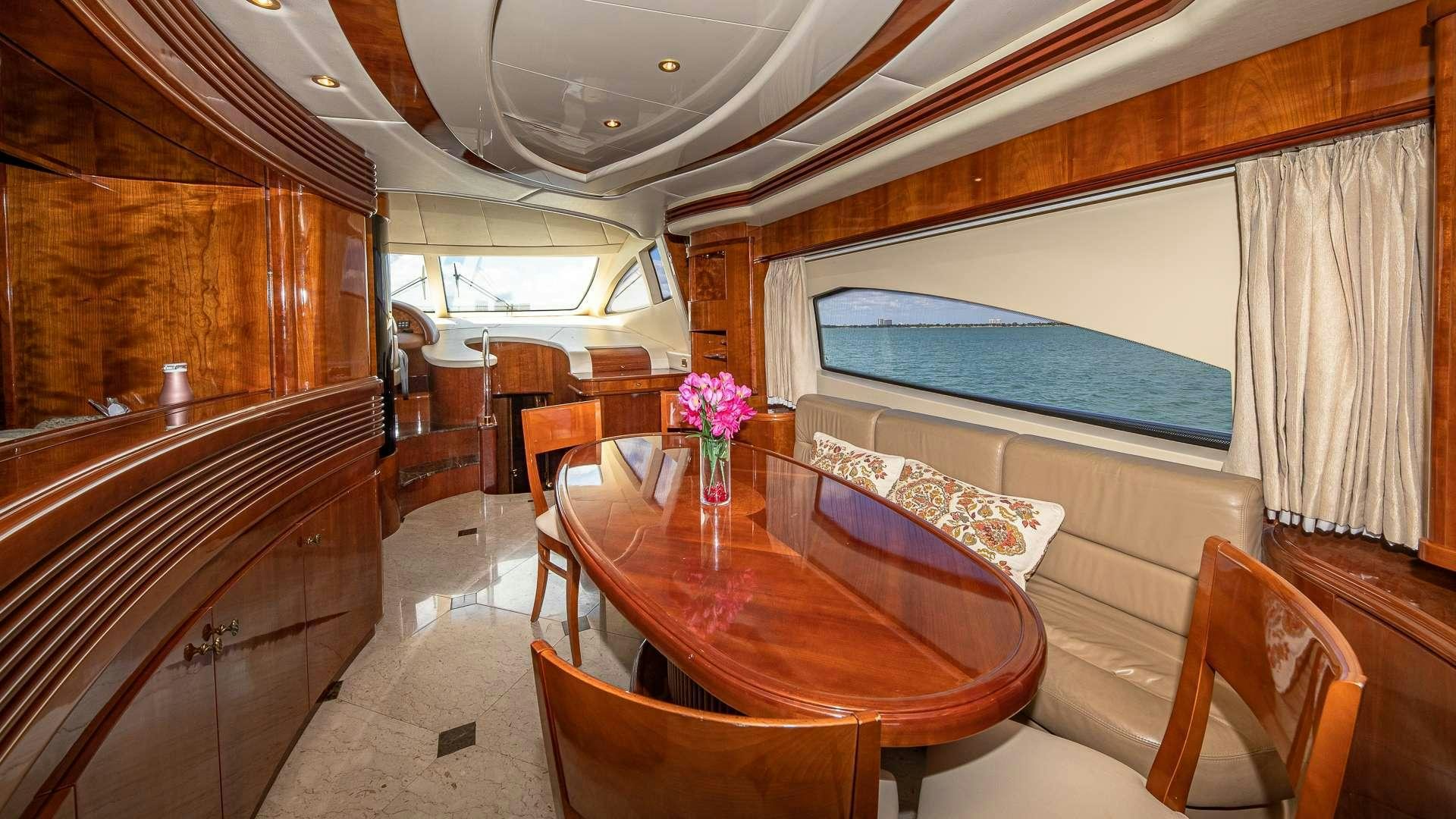 a dining room with a large table aboard grace Yacht for Charter