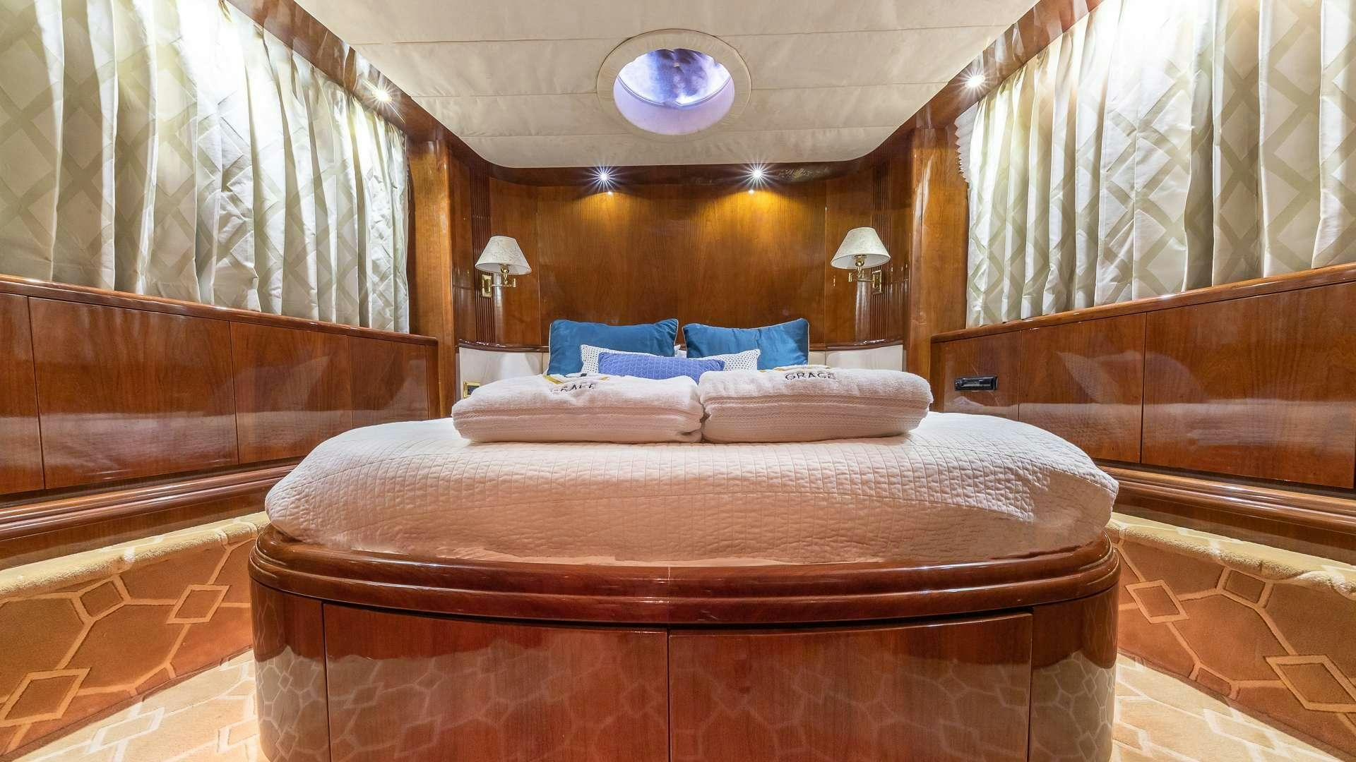 a large bed in a room aboard grace Yacht for Charter