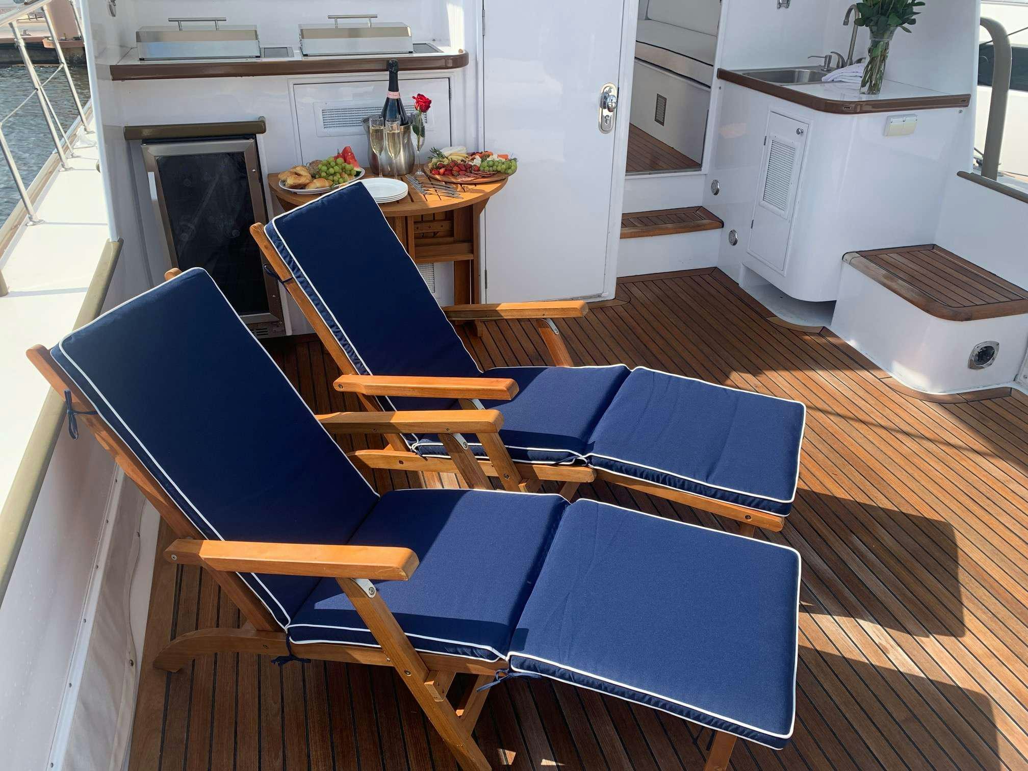 a kitchen with a dining table aboard SEA BOUND Yacht for Charter