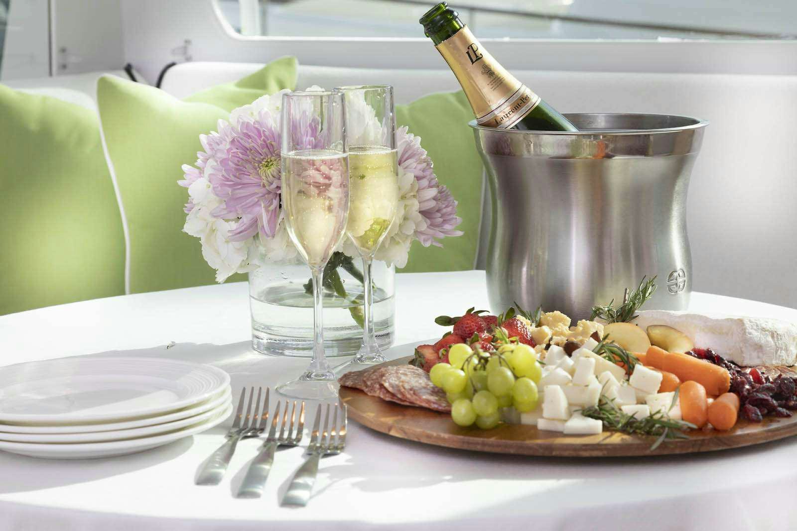 a table with food and glasses aboard SEA BOUND Yacht for Charter