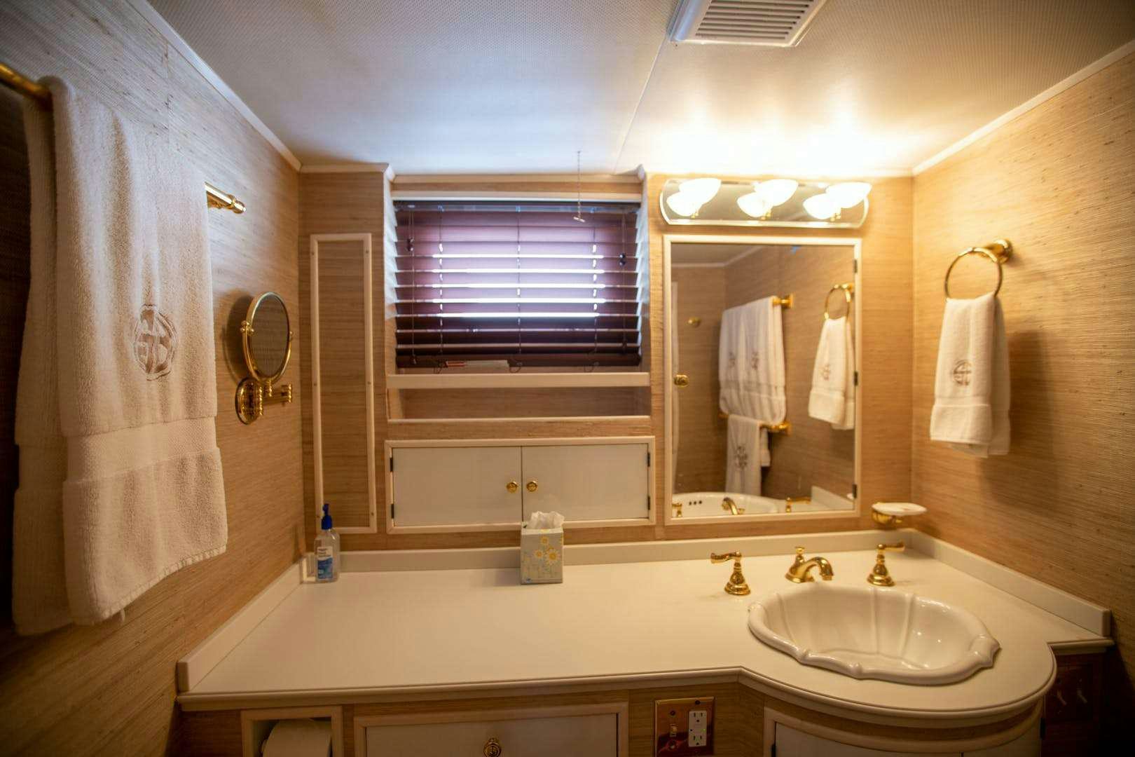 a bathroom with a sink and a mirror aboard SEA BOUND Yacht for Charter