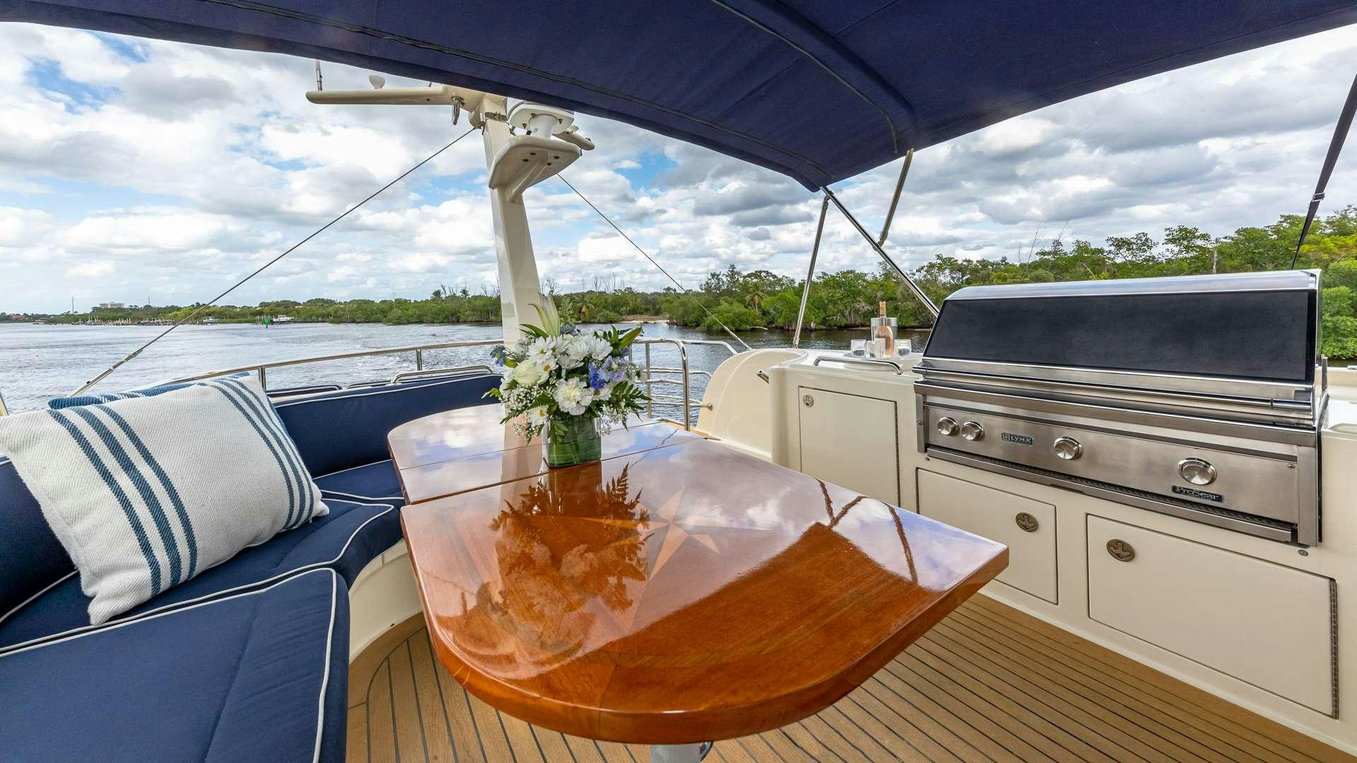 a table with a planter on it aboard FALCON Yacht for Charter