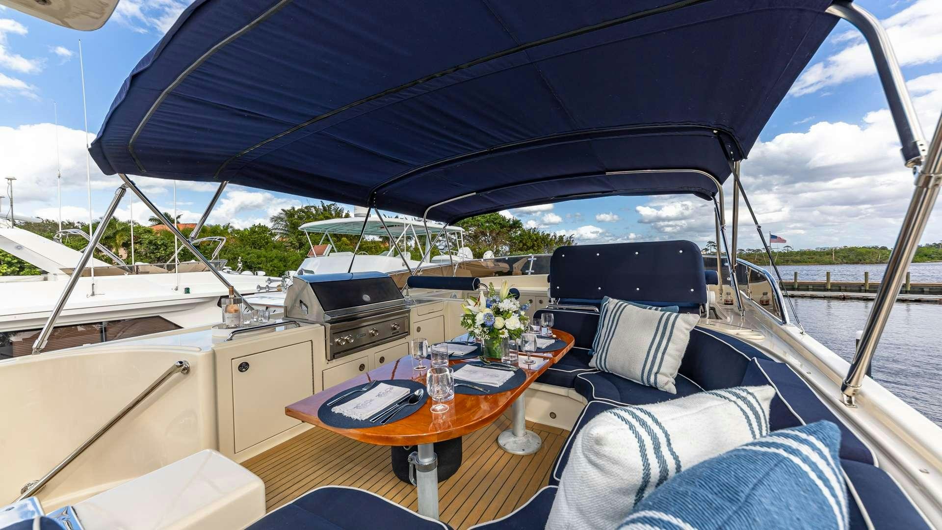 a tent with a table and chairs aboard FALCON Yacht for Charter