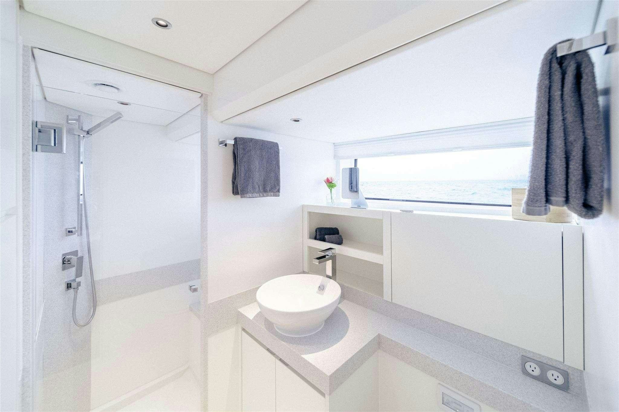 a bathroom with a sink and a mirror aboard GO N HOT Yacht for Charter
