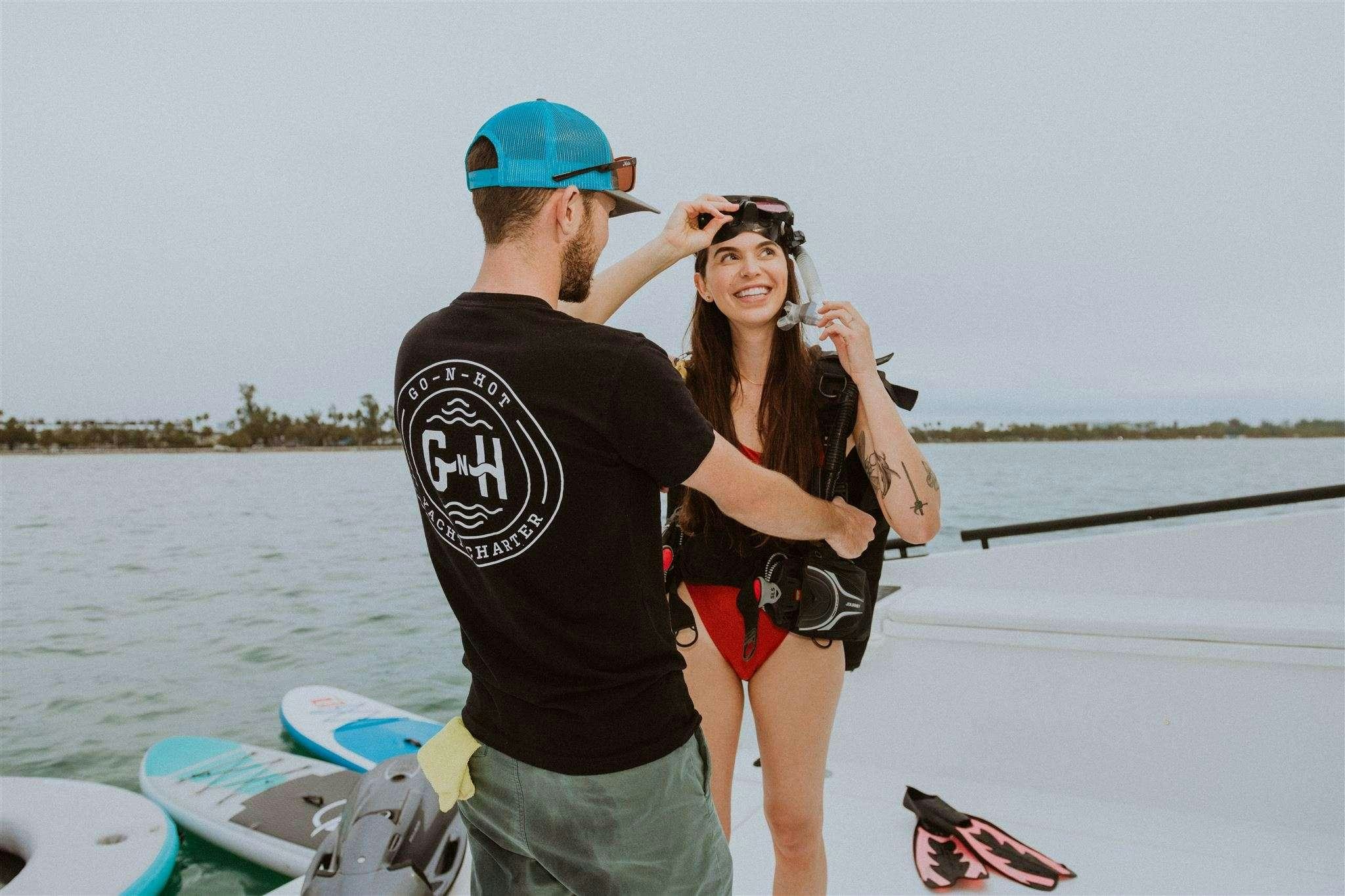 a man and woman on a boat aboard GO N HOT Yacht for Charter