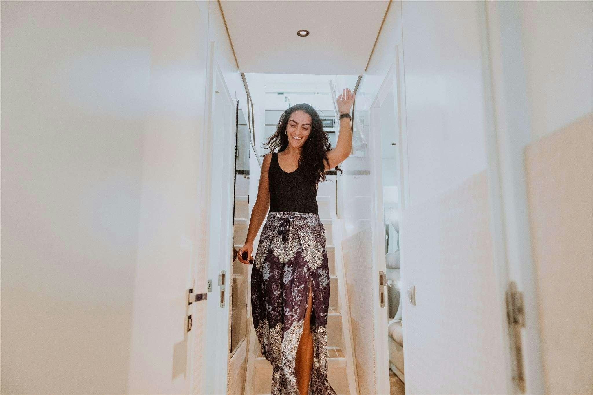 a person holding a door aboard GO N HOT Yacht for Charter