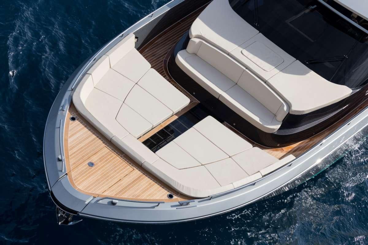 a group of white boats on a blue surface aboard JANINA Yacht for Charter