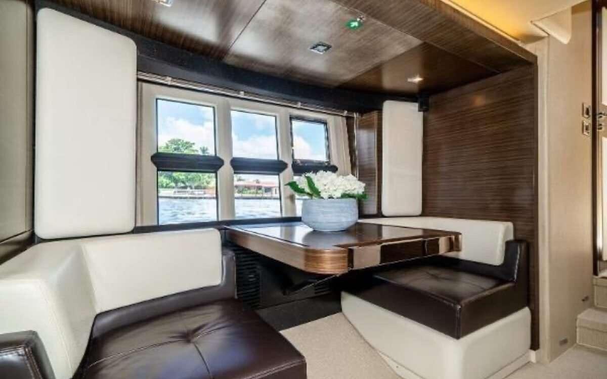 a room with a table and couches aboard CORSAIR Yacht for Charter