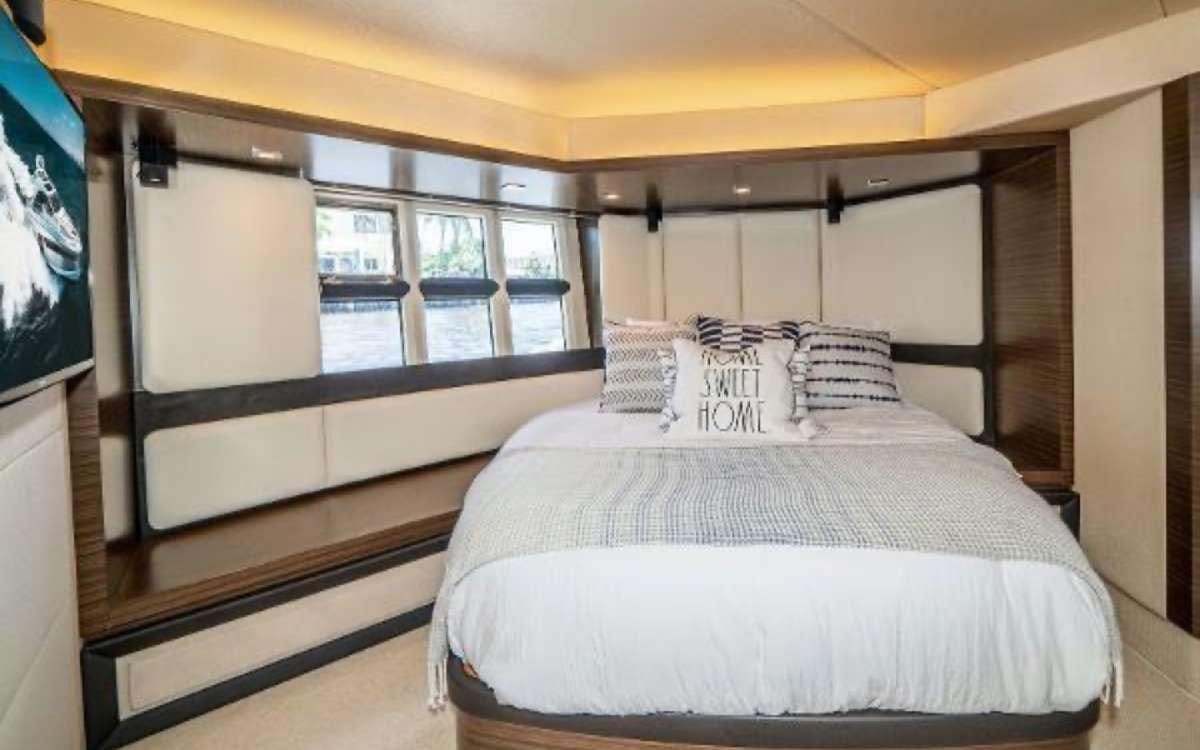 a bed in a room aboard CORSAIR Yacht for Charter