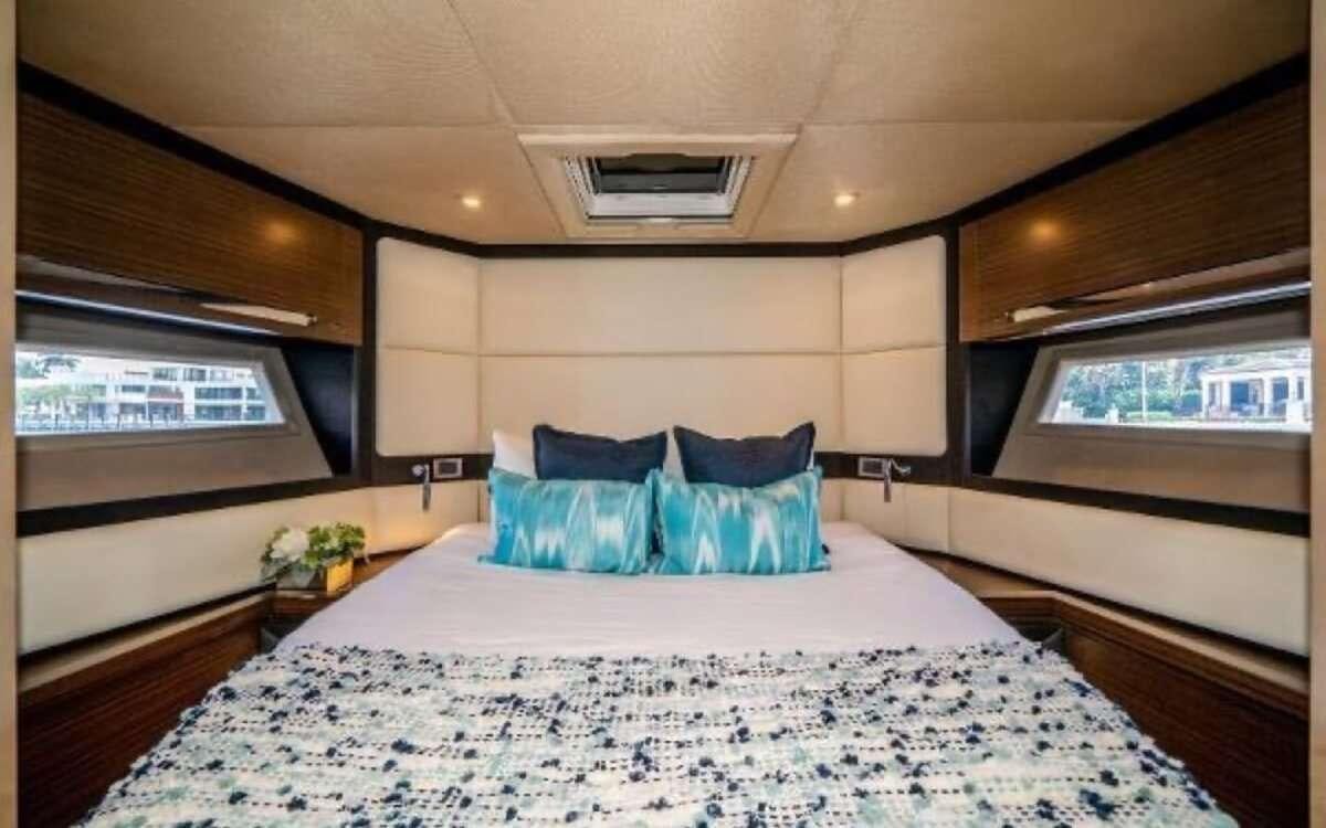 a large bed in a room aboard CORSAIR Yacht for Charter