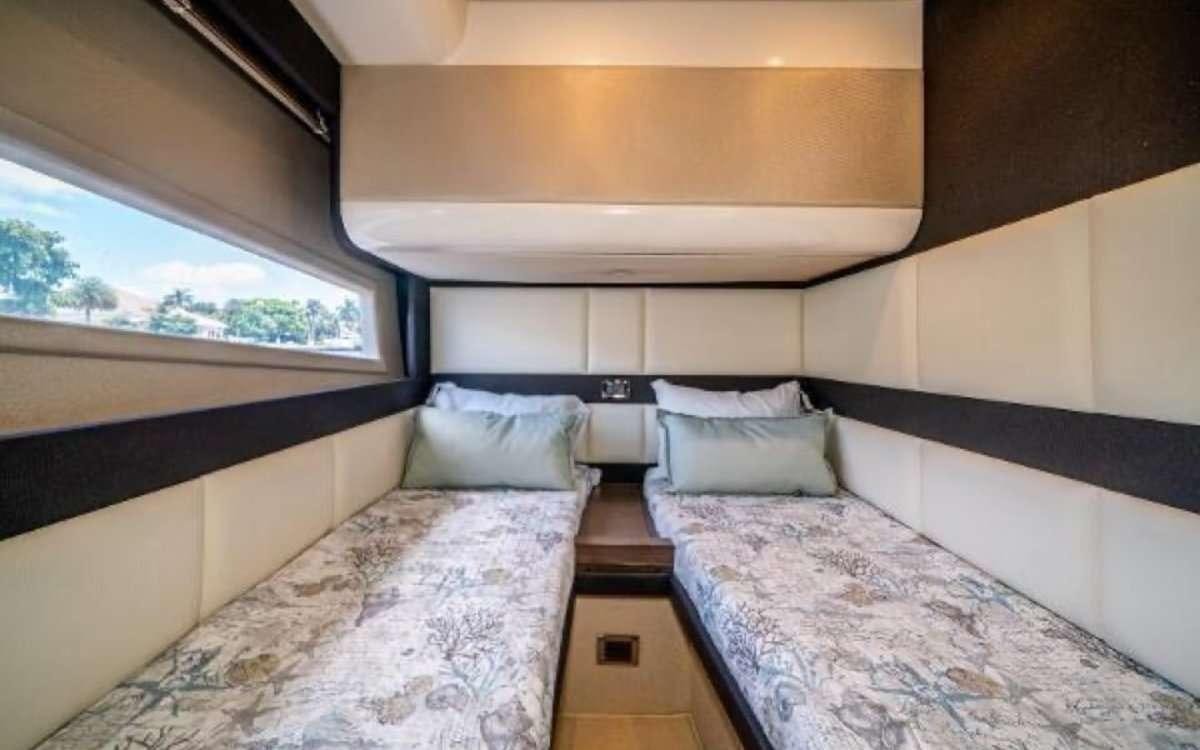 a room with two beds aboard CORSAIR Yacht for Charter