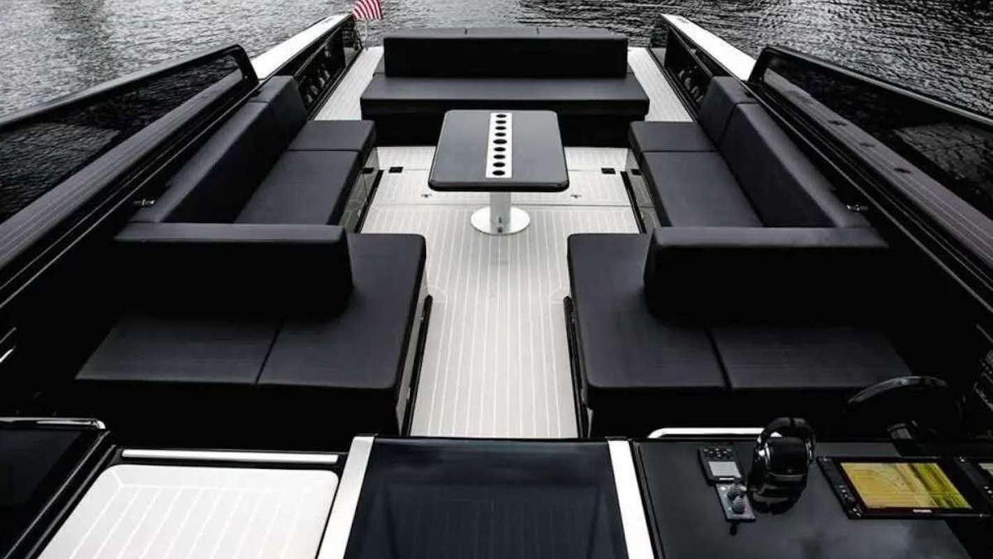 a group of black rectangular objects on a wooden surface aboard BIG BANG Yacht for Charter