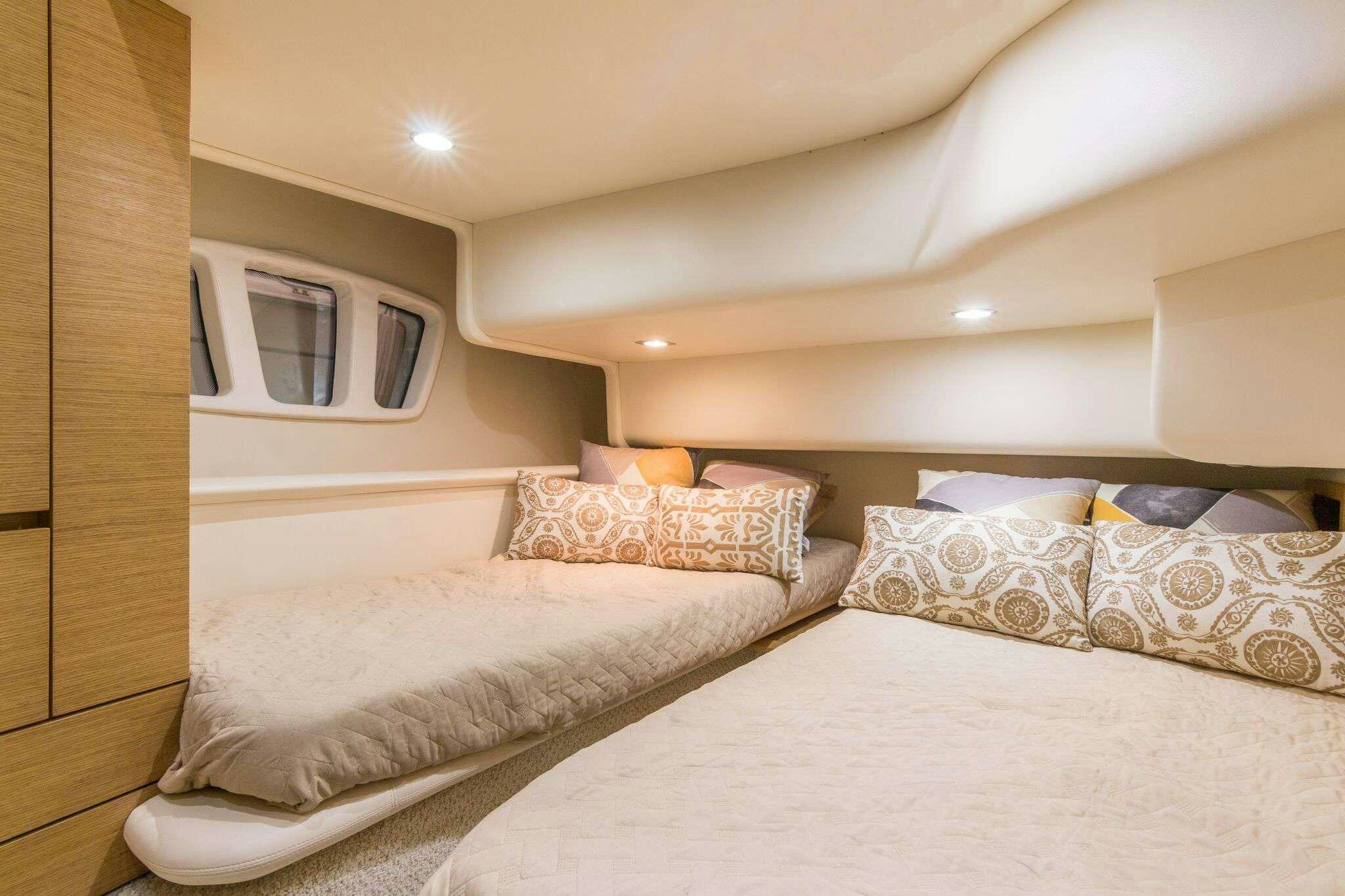 a room with two beds aboard TINA Yacht for Charter
